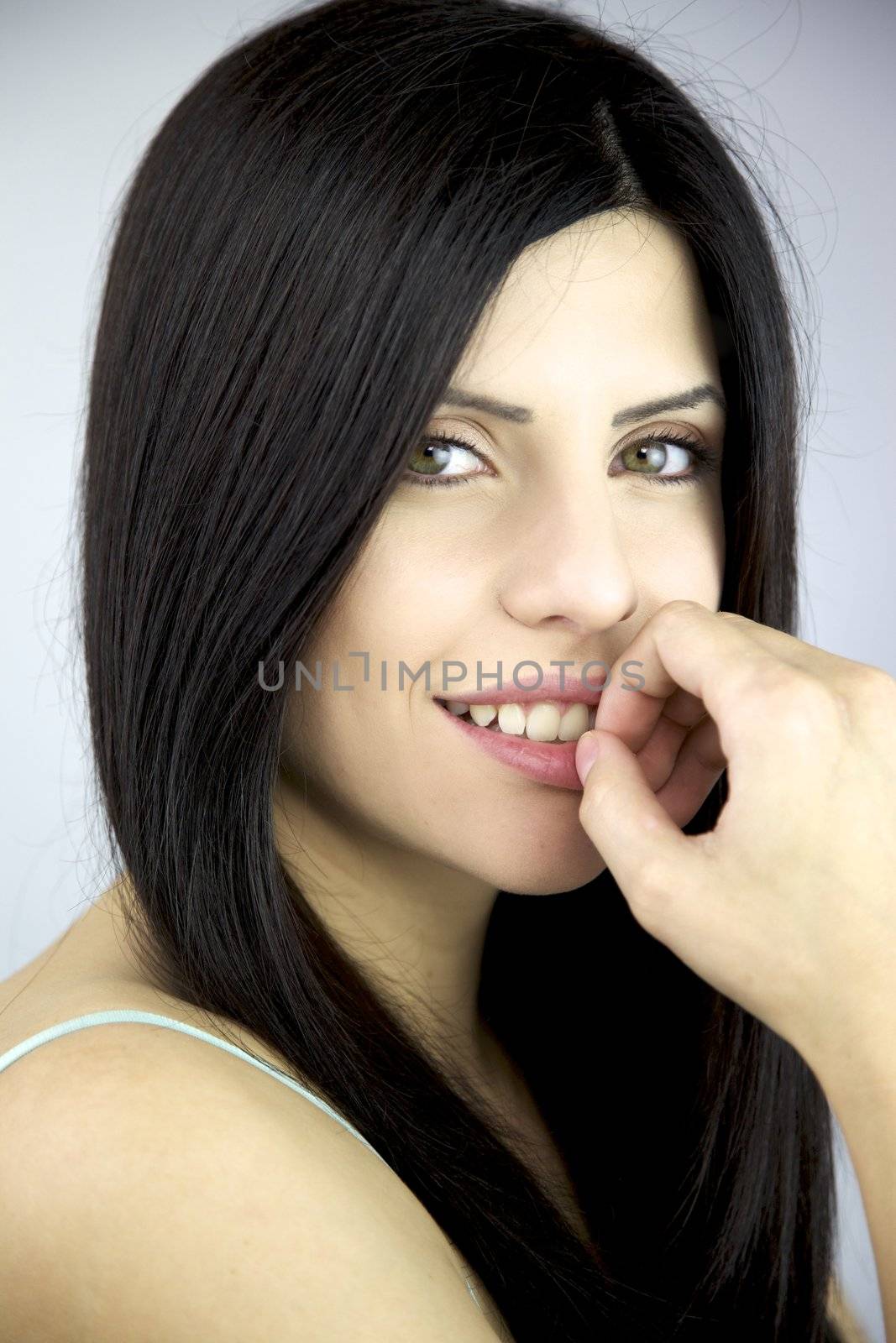 Portrait of beautiful female model with big green eyes by fmarsicano