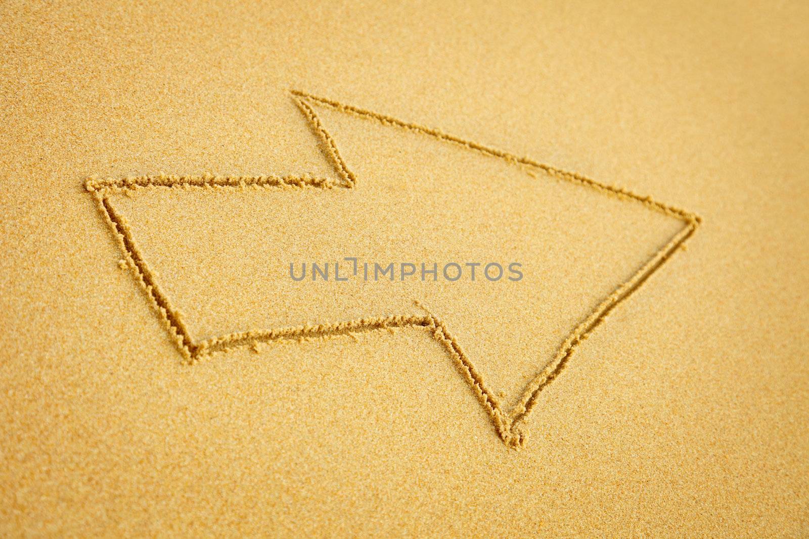 Arrow on beach sand by pzaxe