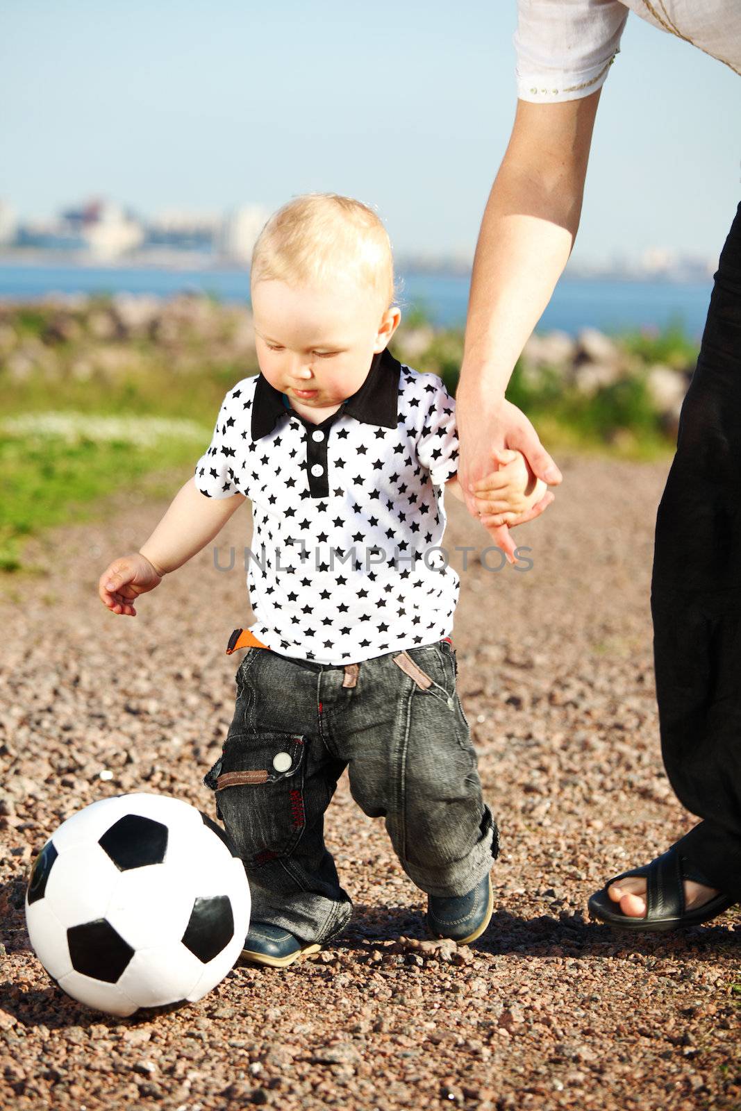 little boy play soccer outdoor