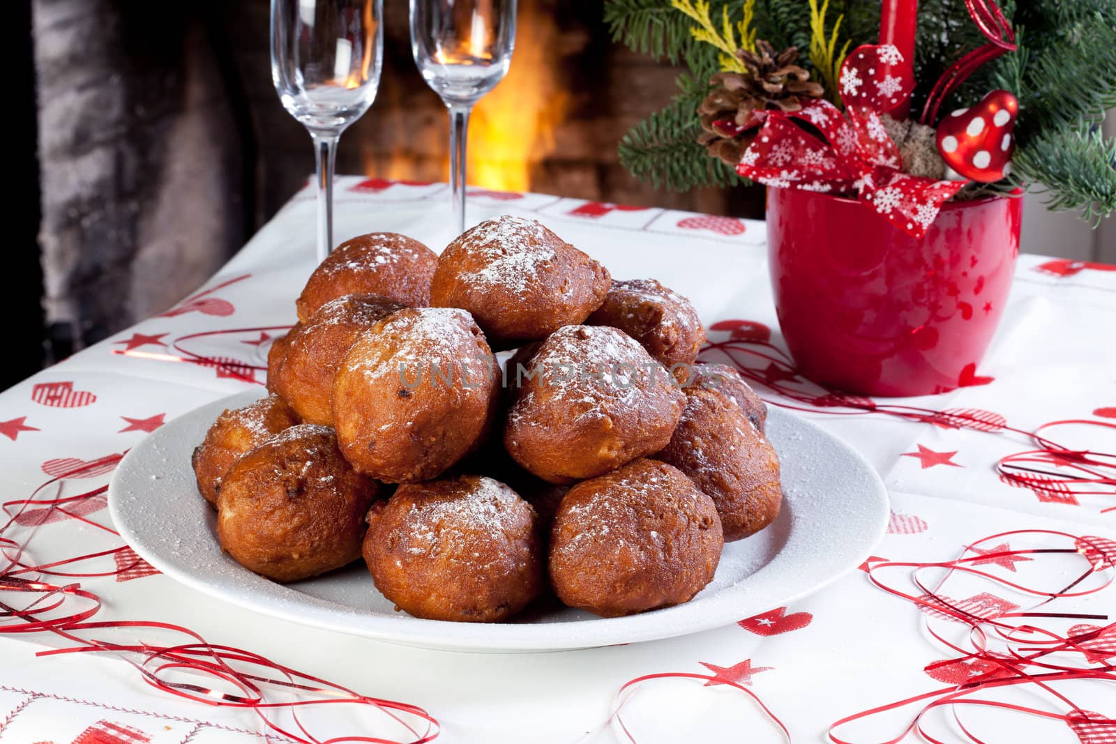 Plate of fresh olie ballen on a christmas table.