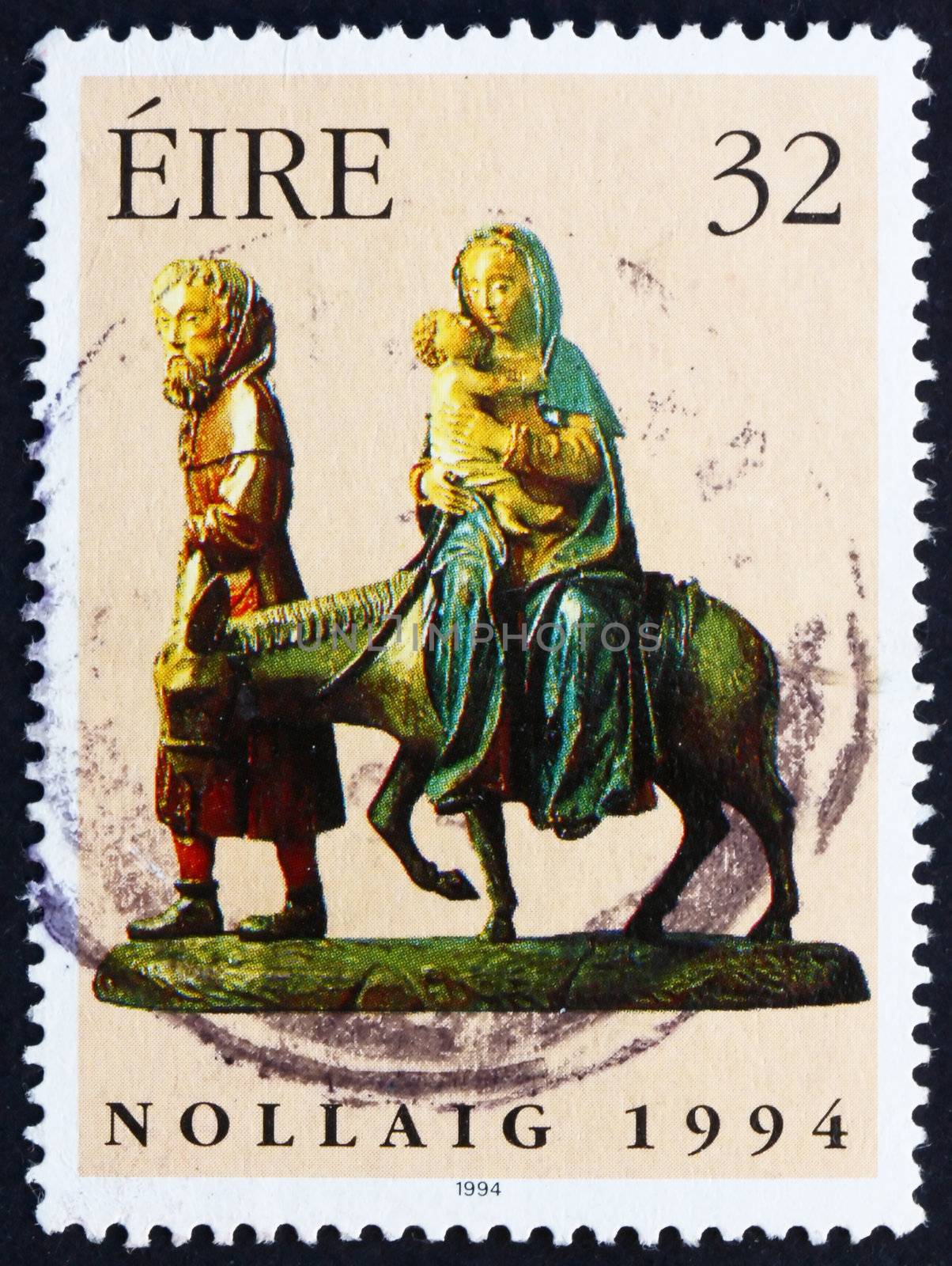 IRELAND - CIRCA 1994: a stamp printed in the Ireland shows Flight into Egypt, 15th Century Wood Carving, Christmas, circa 1994