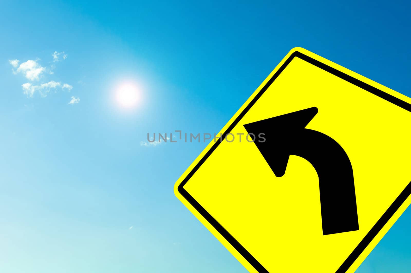 Curved road Traffic Sign on blue sky cloudy and sun