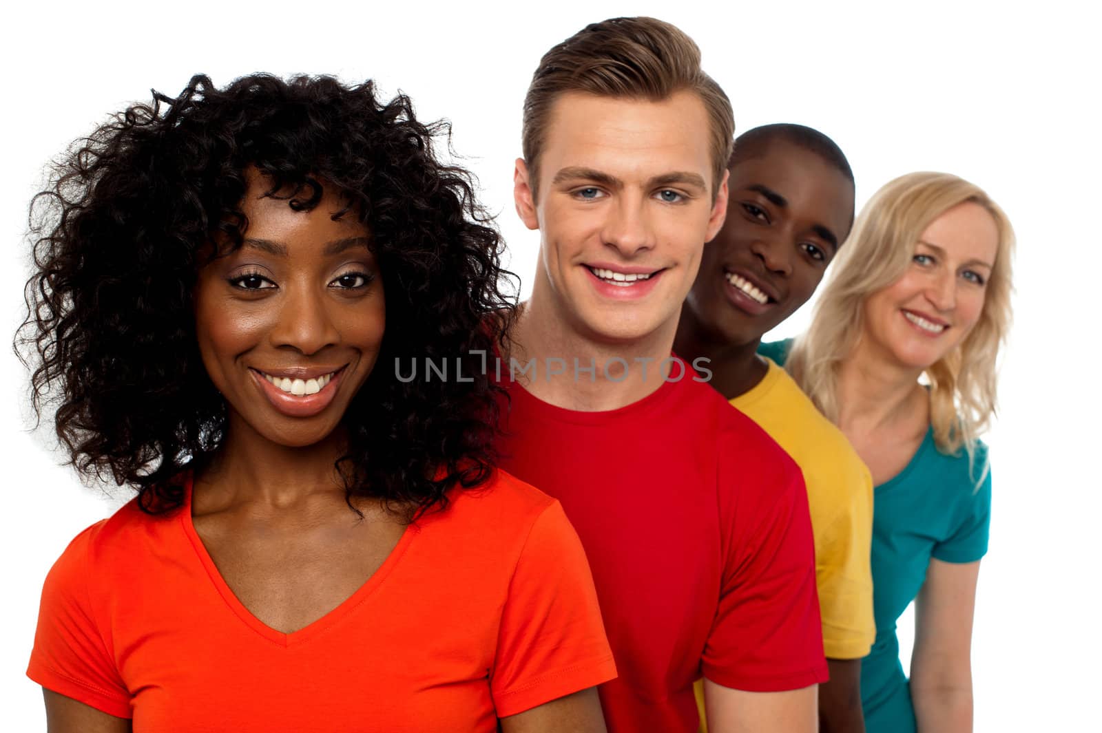 Portrait of smiling group of friends standing behind one another facing camera