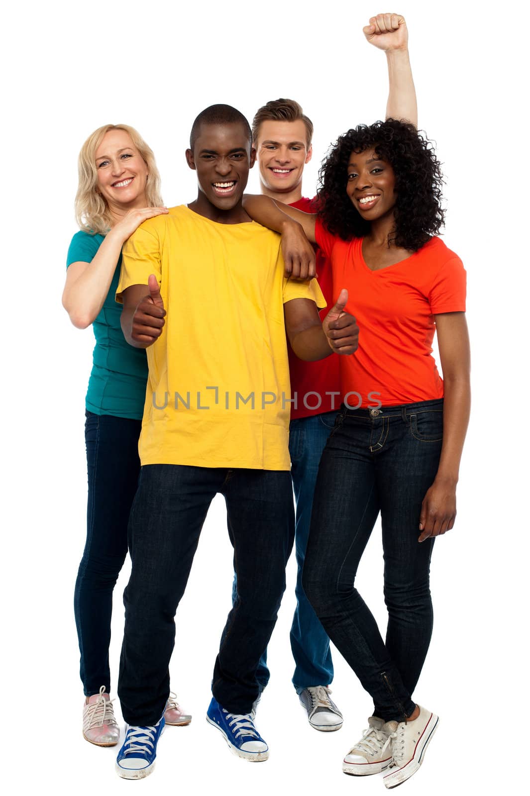 Portrait of joyful young group of friends by stockyimages
