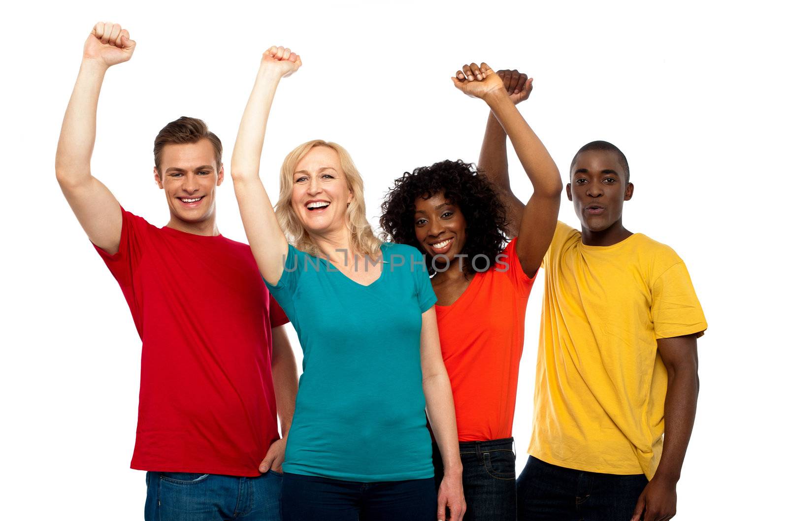 Excited teenager group posing with raised arms and looking at camera