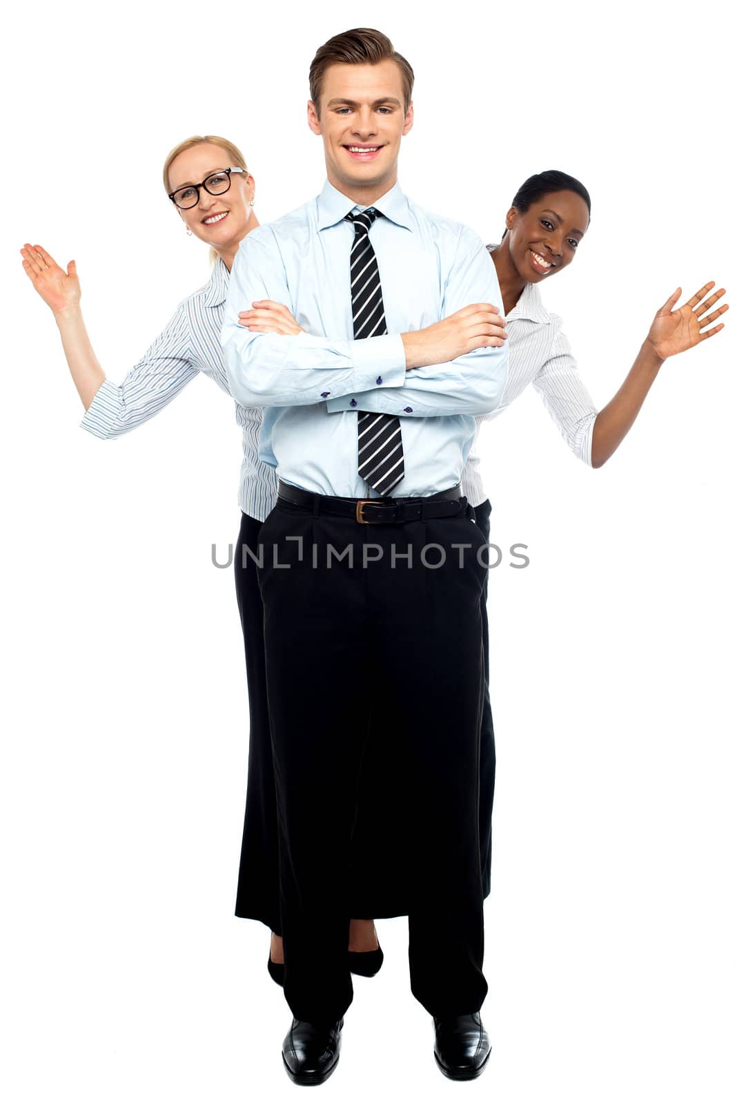 Female corporate waving hi while man stands tall against white background