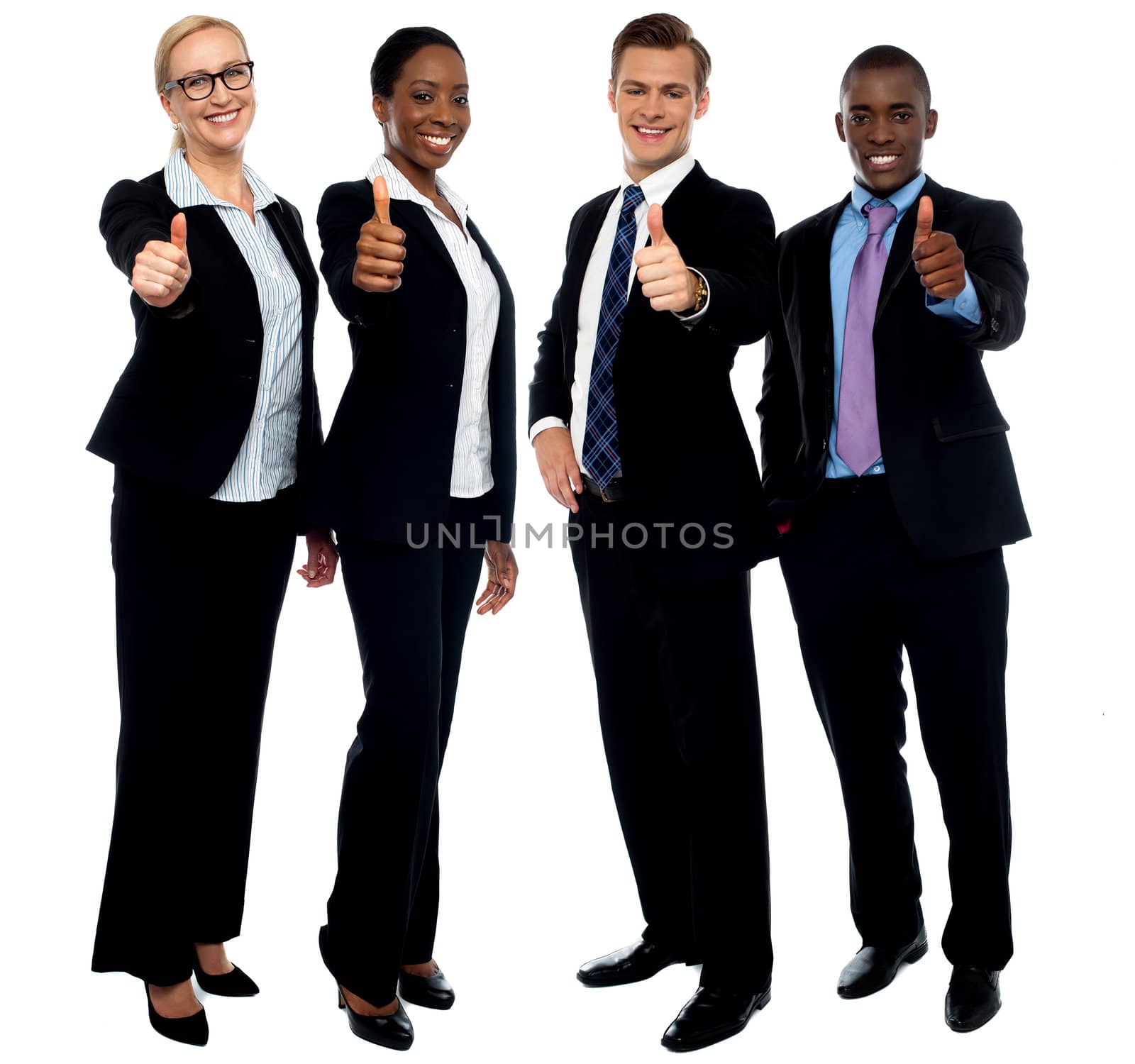 Full length portrait of successful corporate team gesturing thumbs up