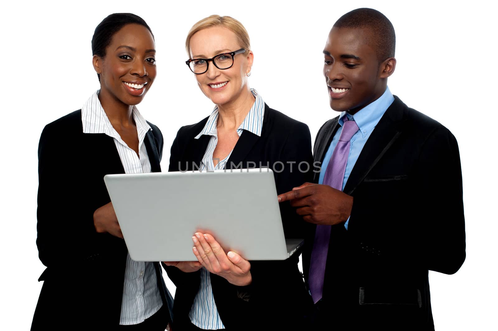 Team of friendly business people using laptop by stockyimages