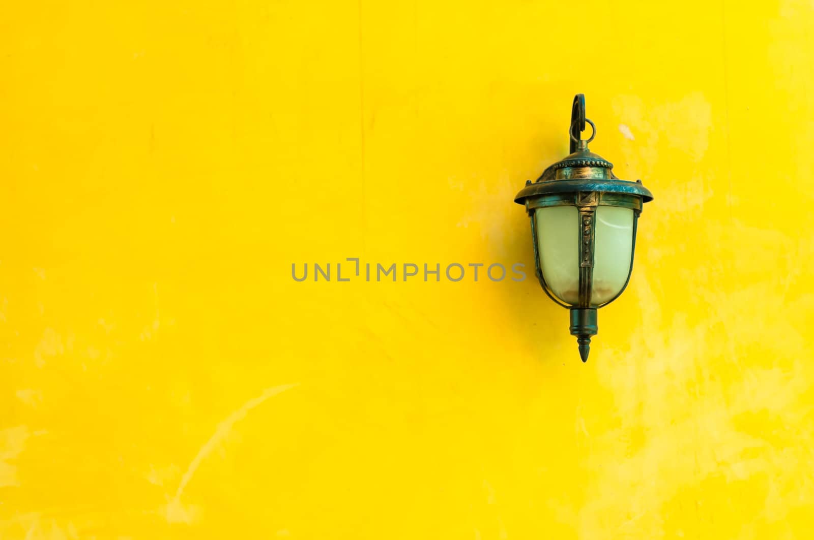 Classic lamp on yellow wall