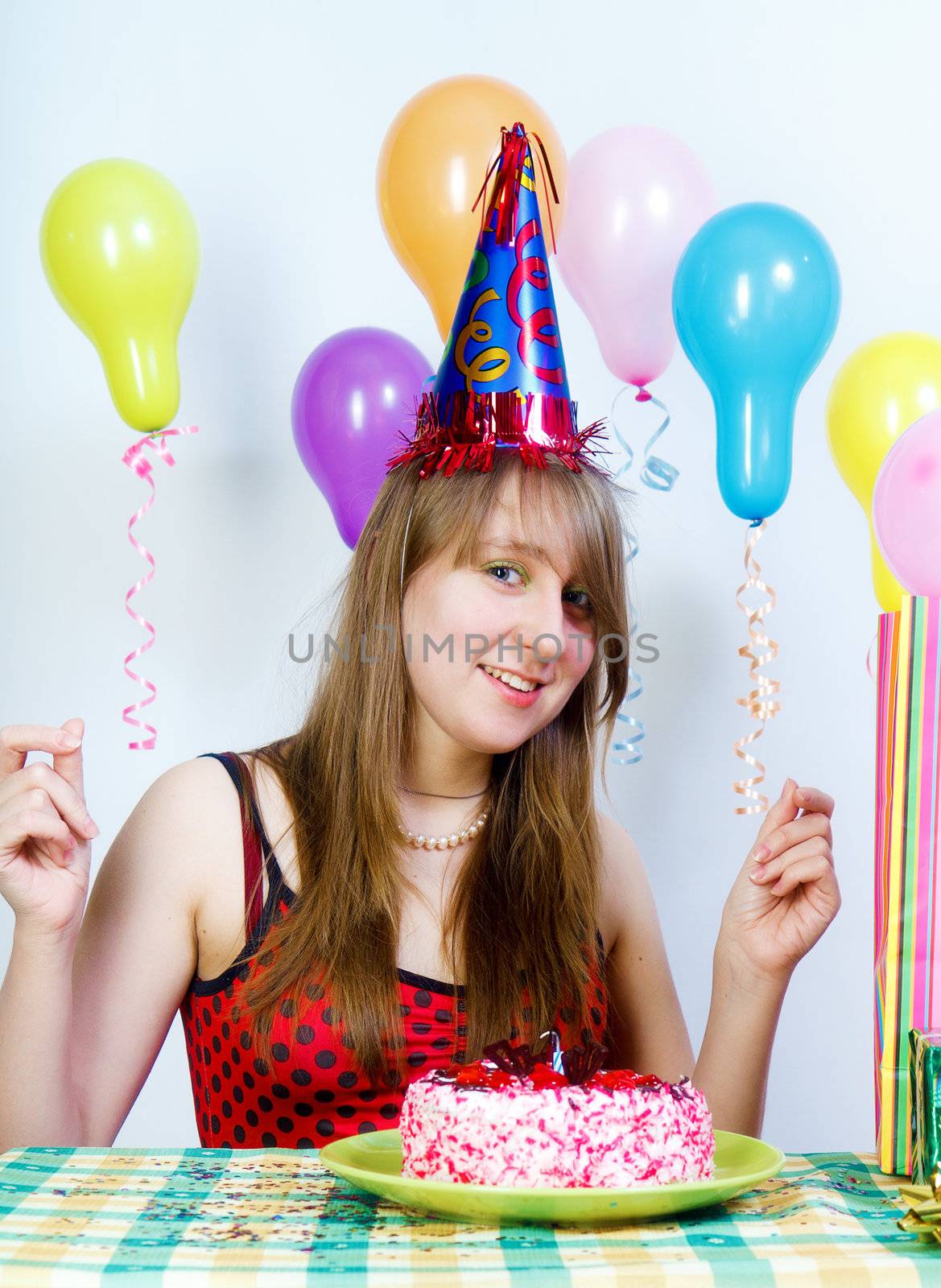 Birthday. Young fun happy girl with cake and balloons