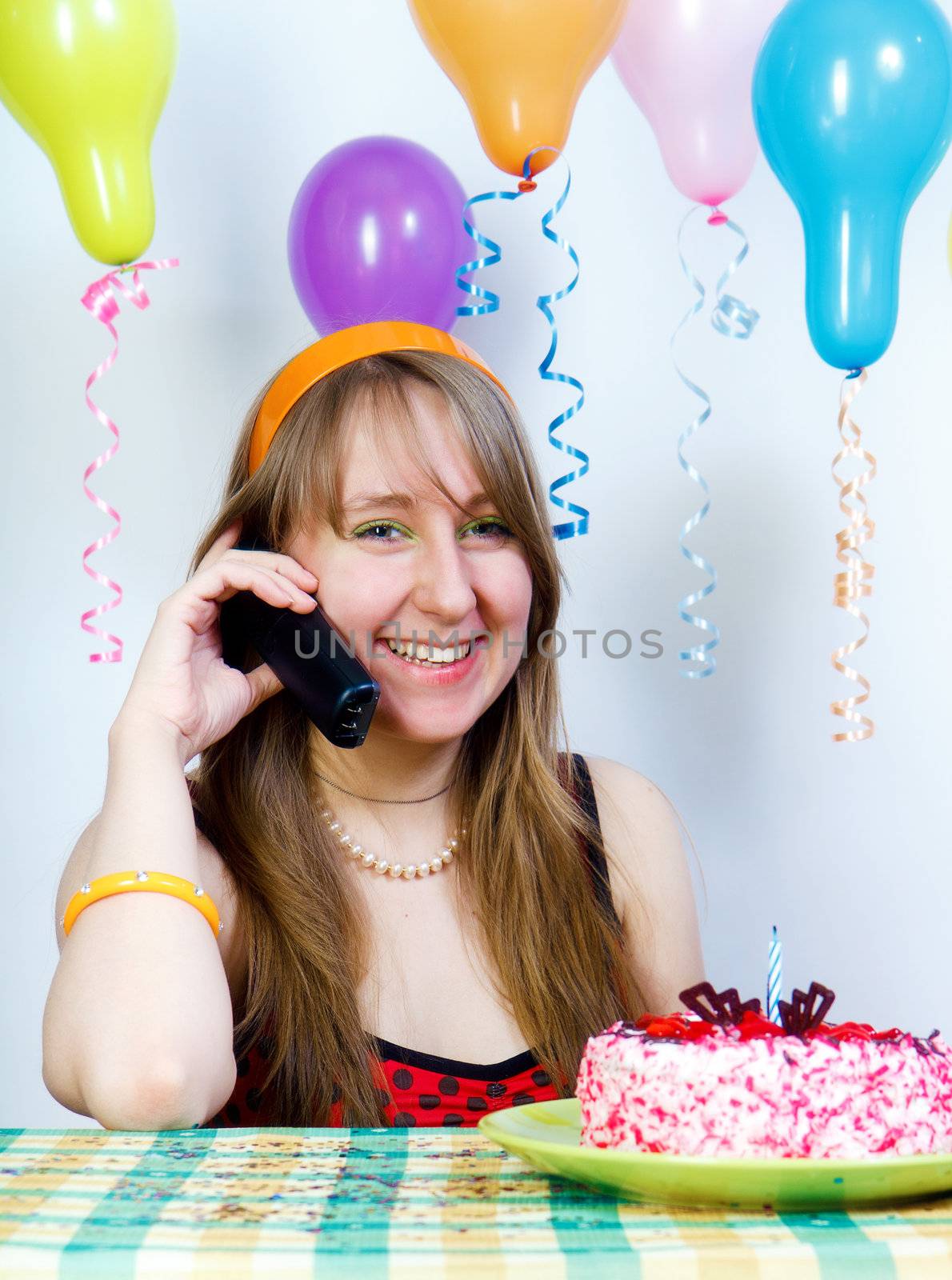 Birthday. Happy attractive girl talking on the phone