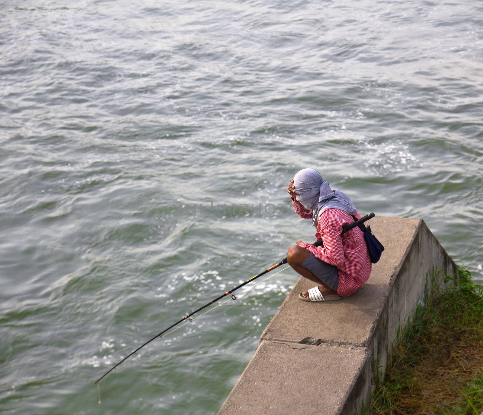 Fishermen waiting to catch a fish hook