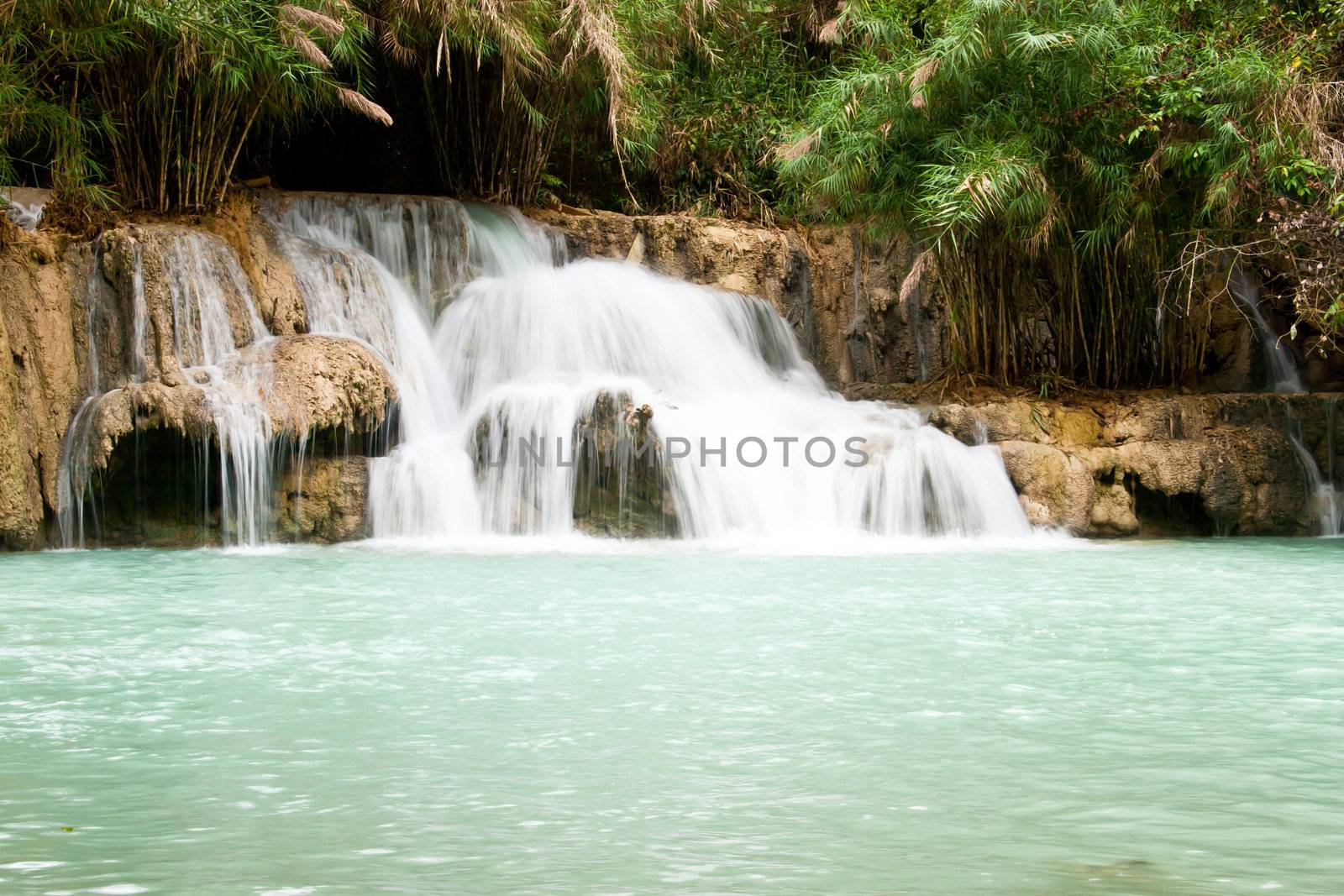 Waterfall and blue stream in the forest Laos