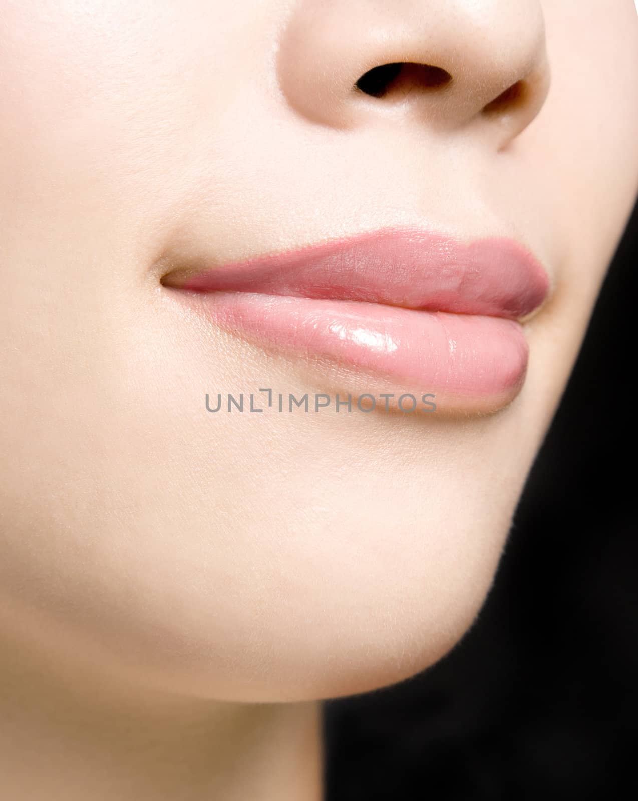 Young woman's glossy pink lips-copyspace