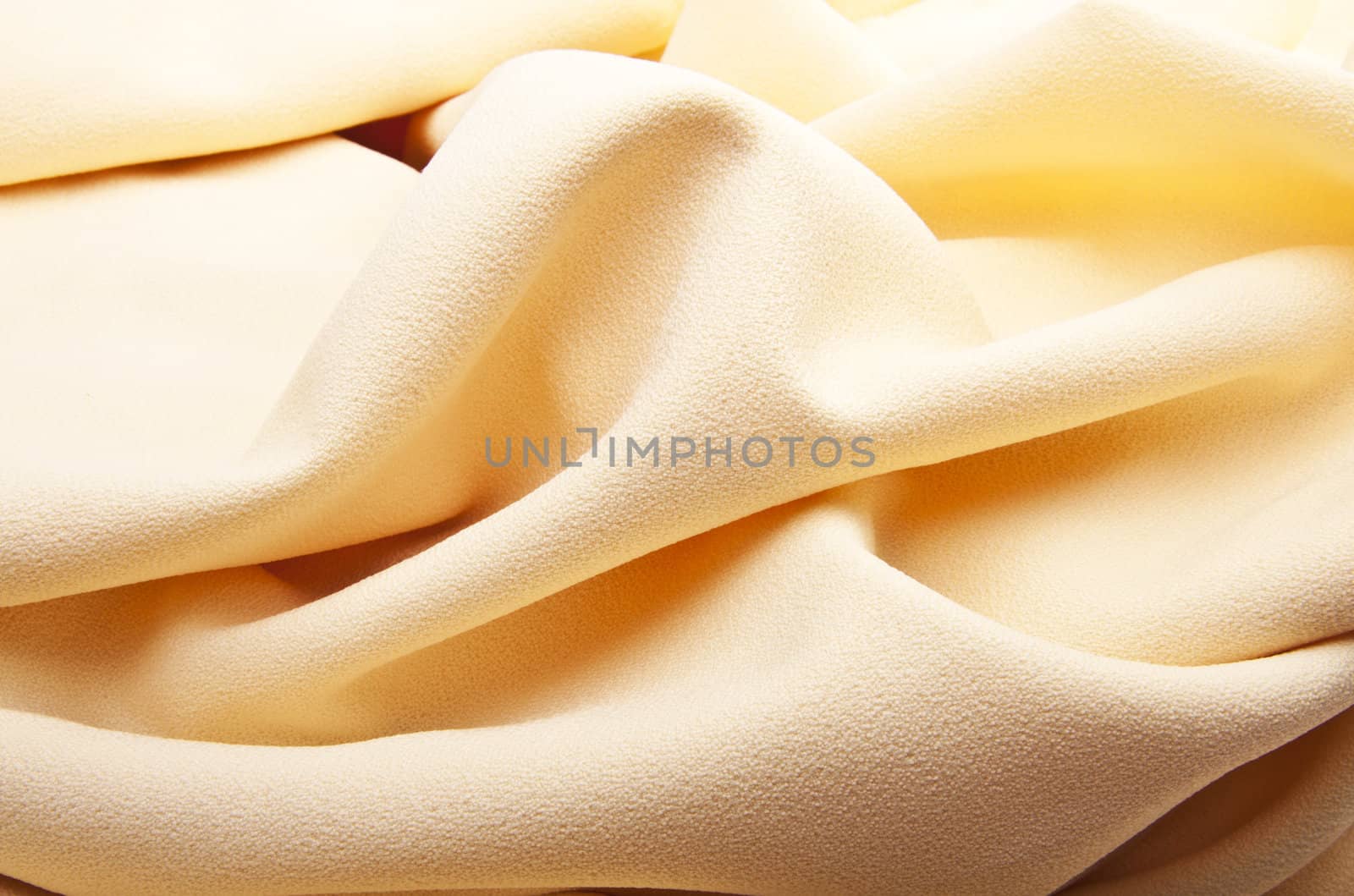 background of bright yellow silk with waves
