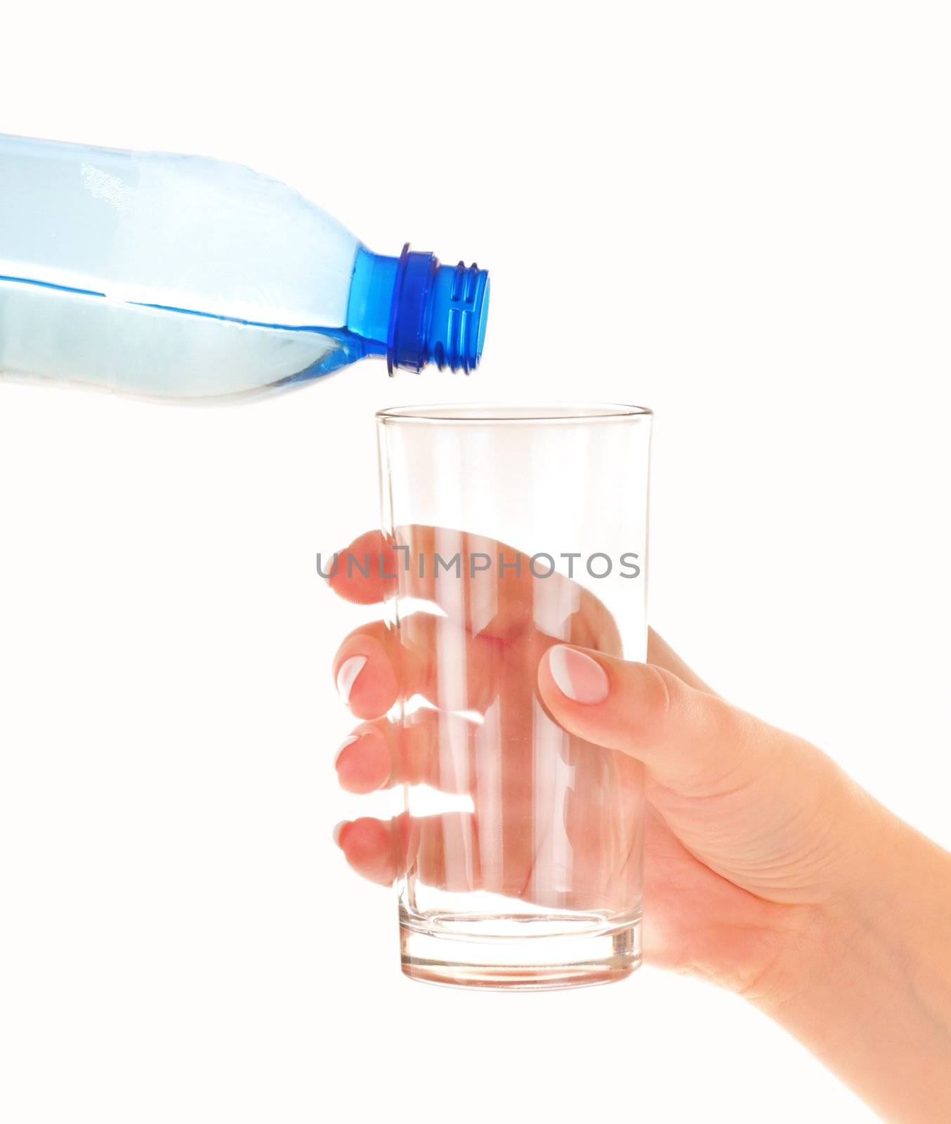 Female hand with empty glass and plastic blue bottle with clean water on white background