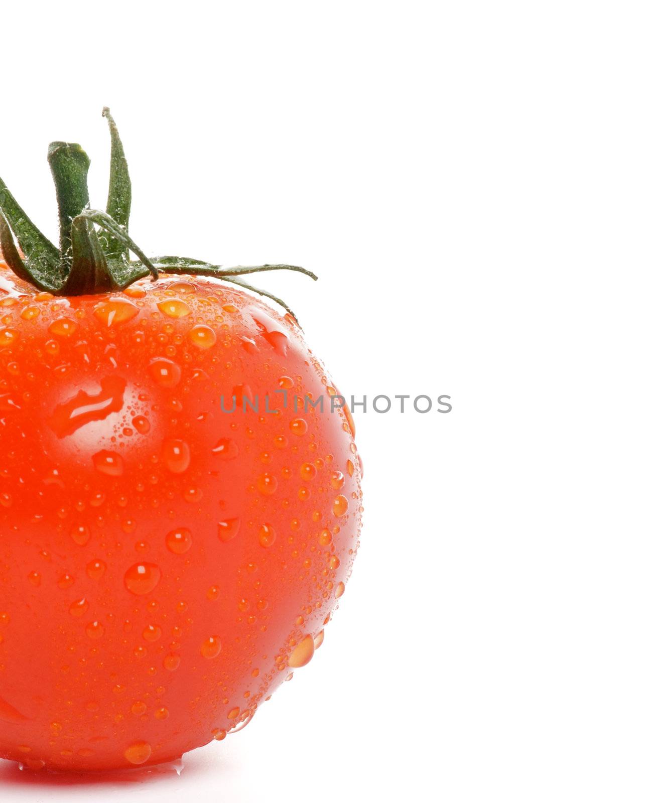 Half of Tomato straight from garden with water droplets isolated on white background