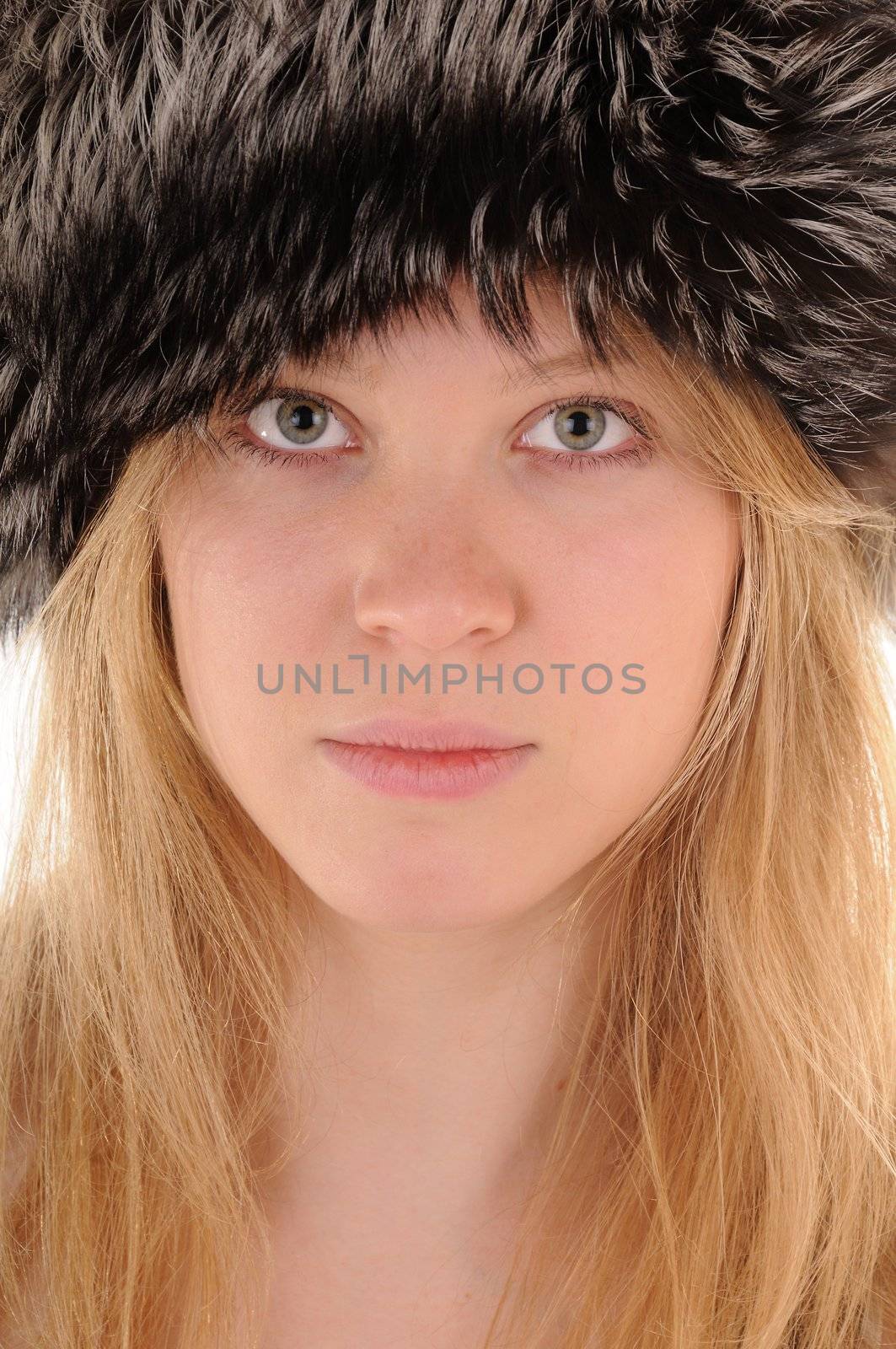 Blonde girl in fur hat.