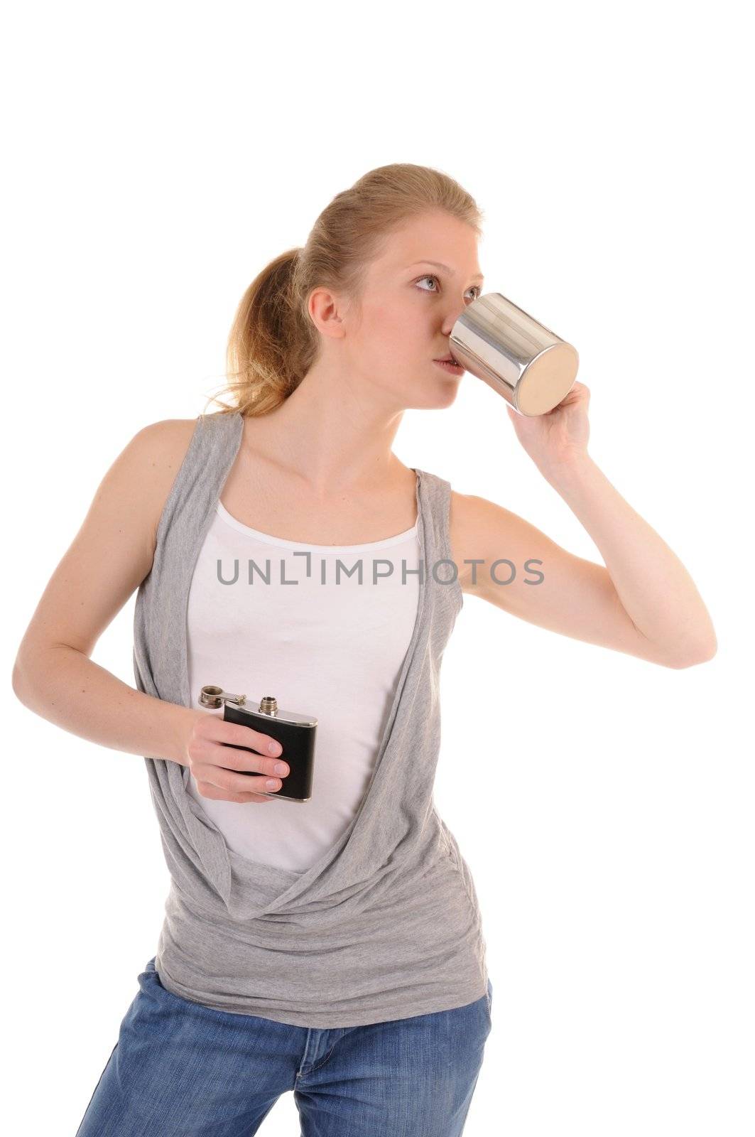 Casual blonde girl with metal cup and flack is drinking