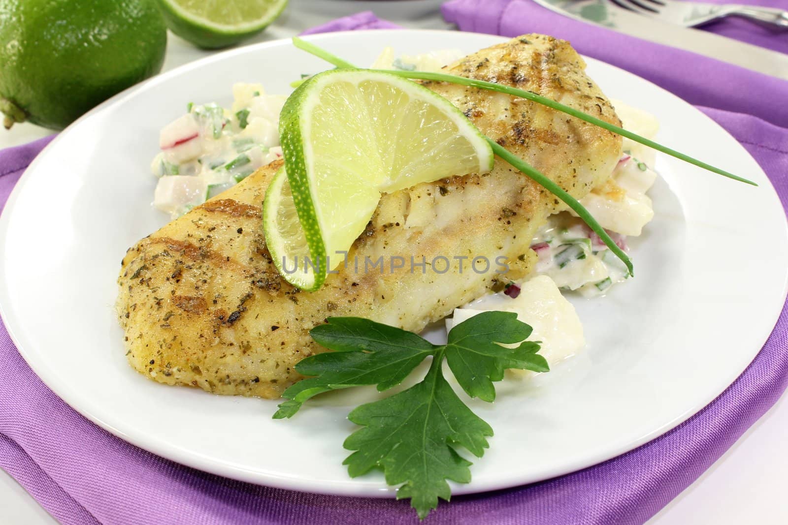 Potato salad with fresh herbs and hake fillet