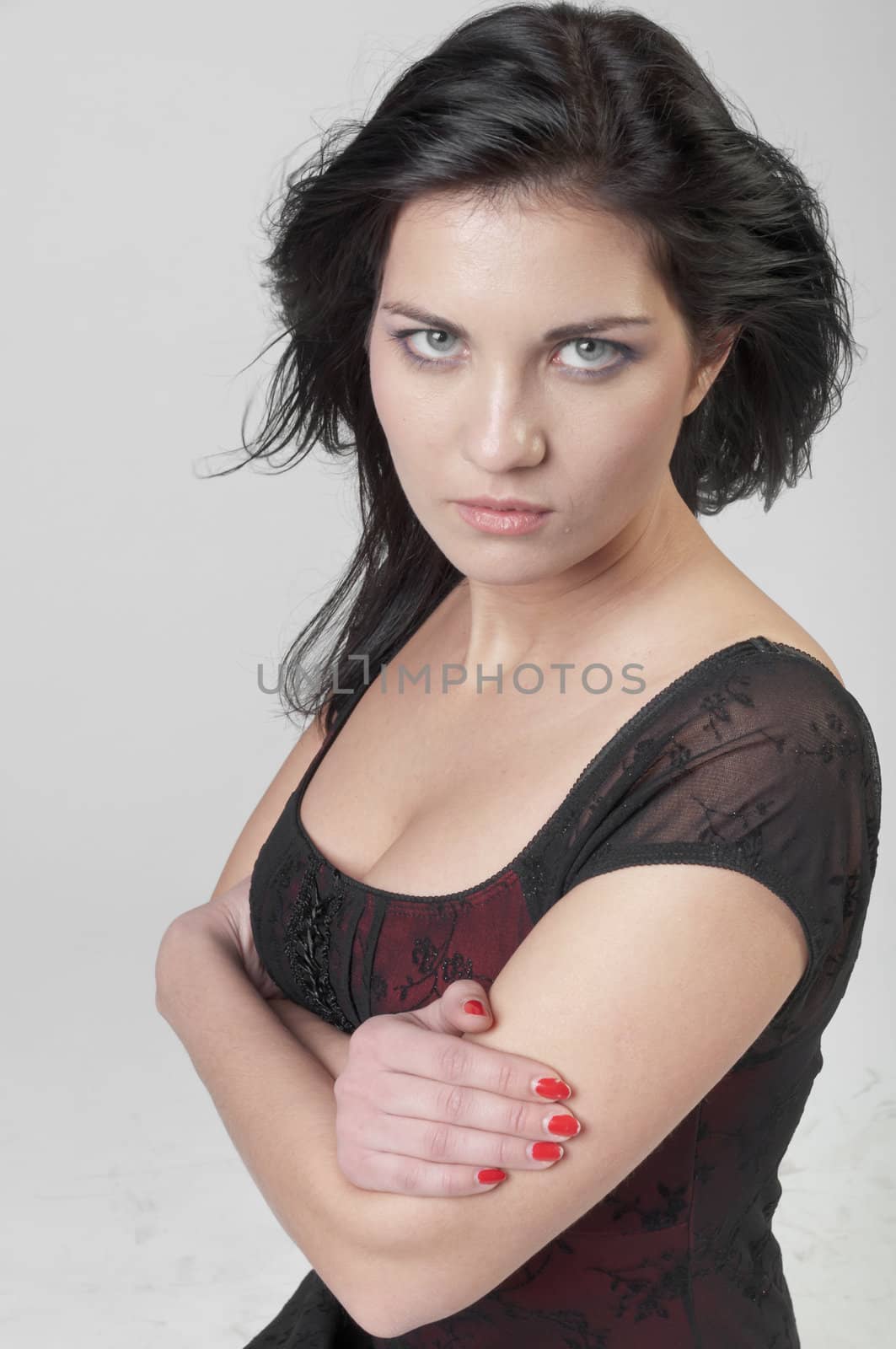 Portrait of a young and beautiful girl in a dark-colored clothing