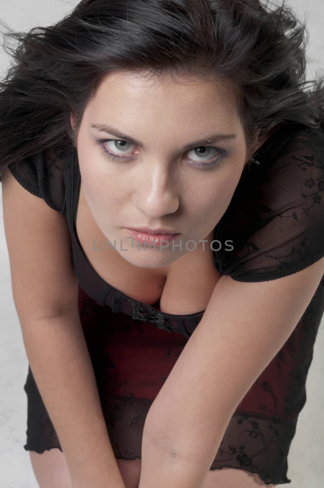 Portrait of a young and beautiful girl in a dark-colored clothing