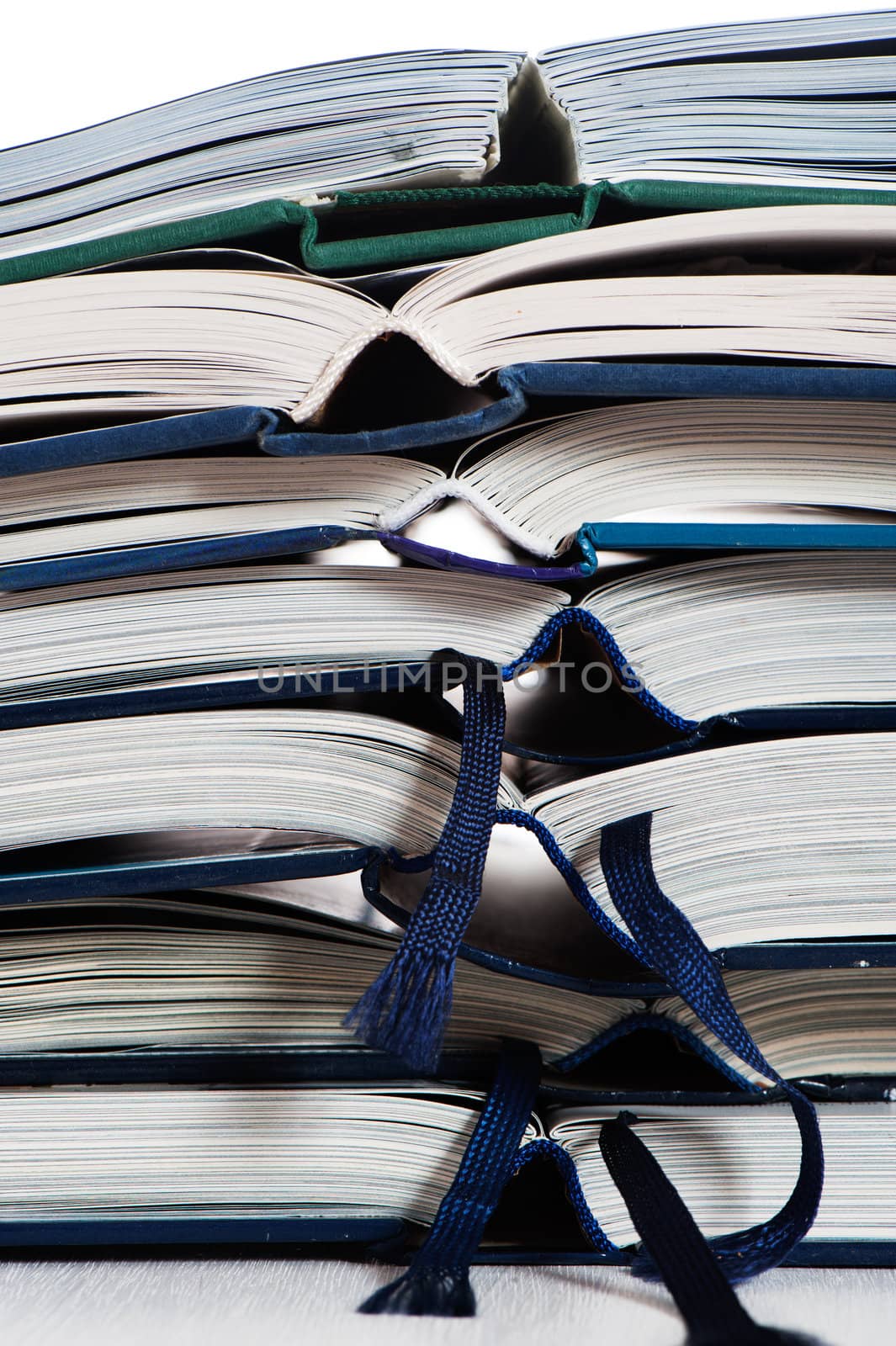 Close up of a stack open books