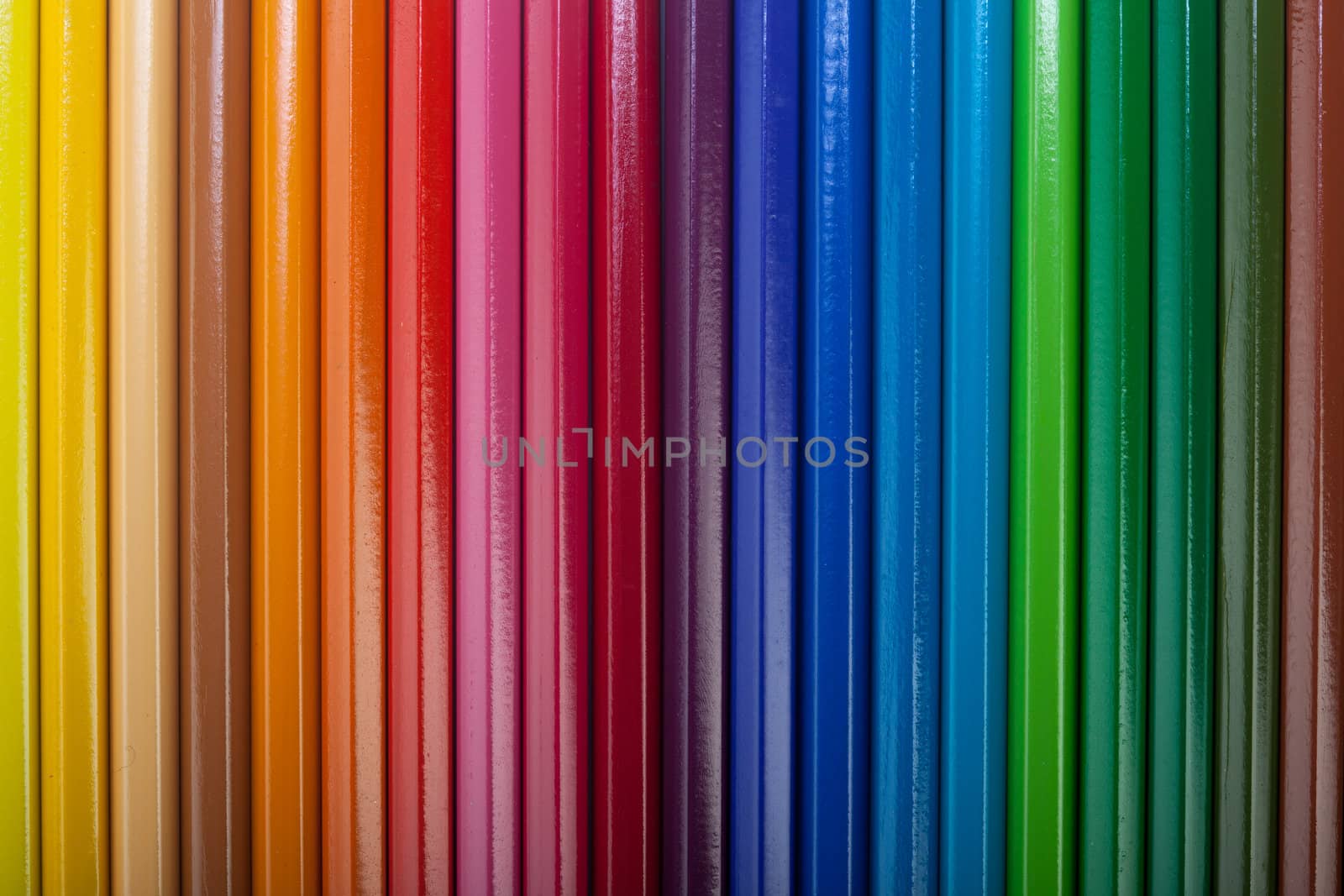 A vivid image with various colored pencils such as yellow, orange, red, pink, green and blue.