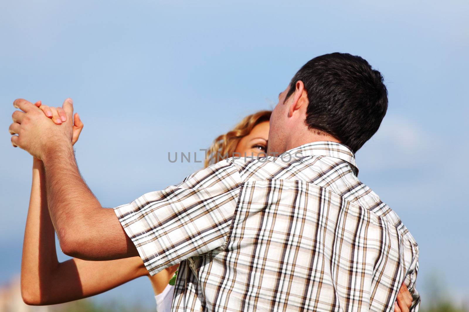 man and woman dance in the sky