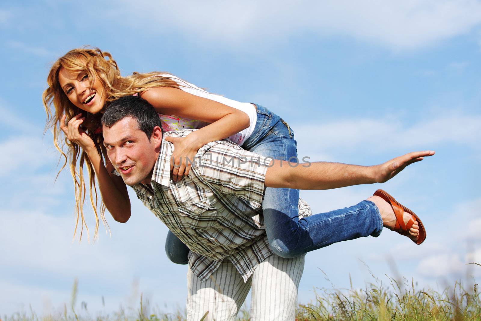 man and woman hug in the sky