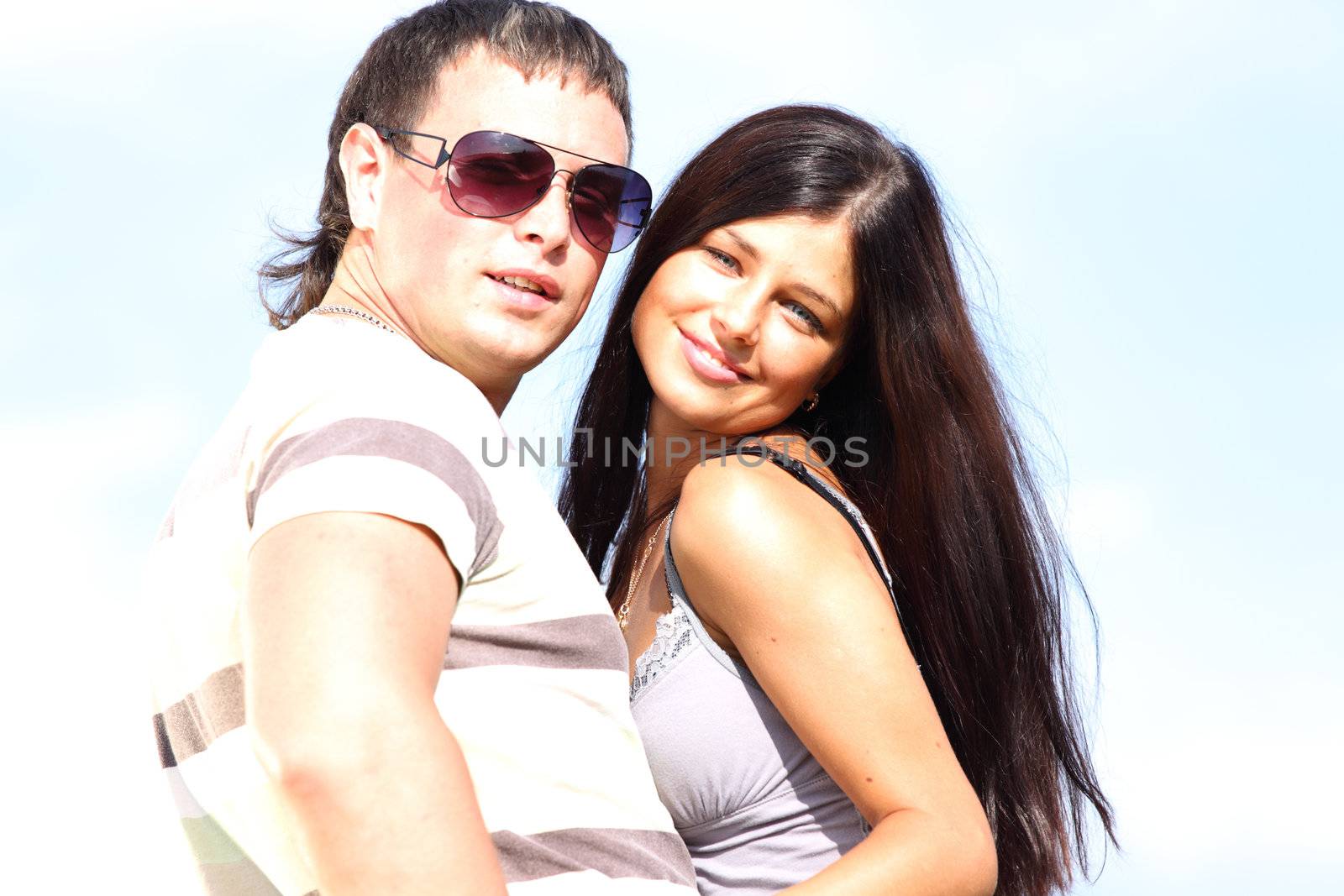 man and woman hug sky on background
