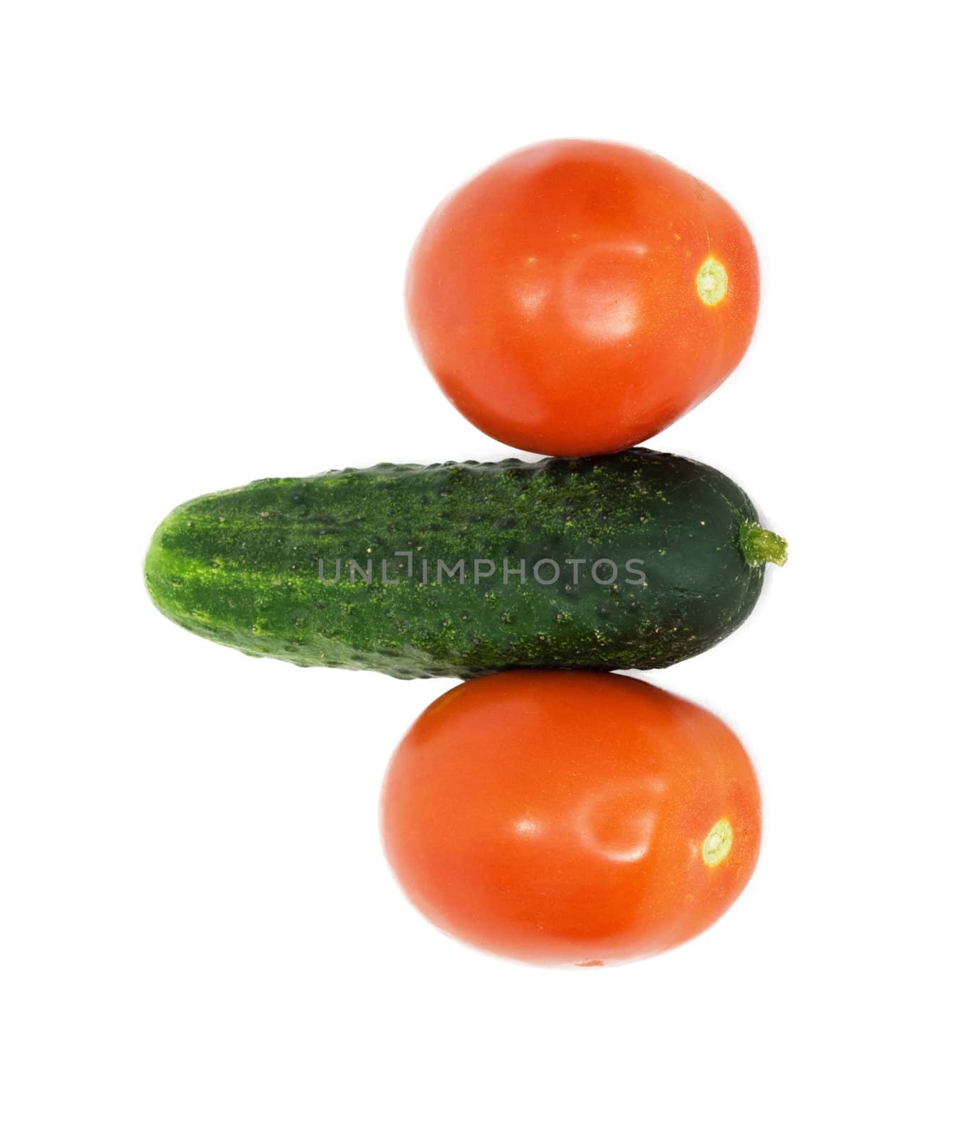 two tomatoes were insulated and one cucumber on white