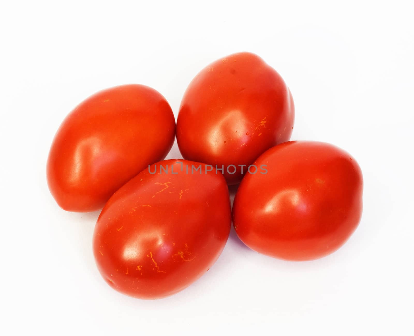 Four ripe tomatoes isolated on white background 