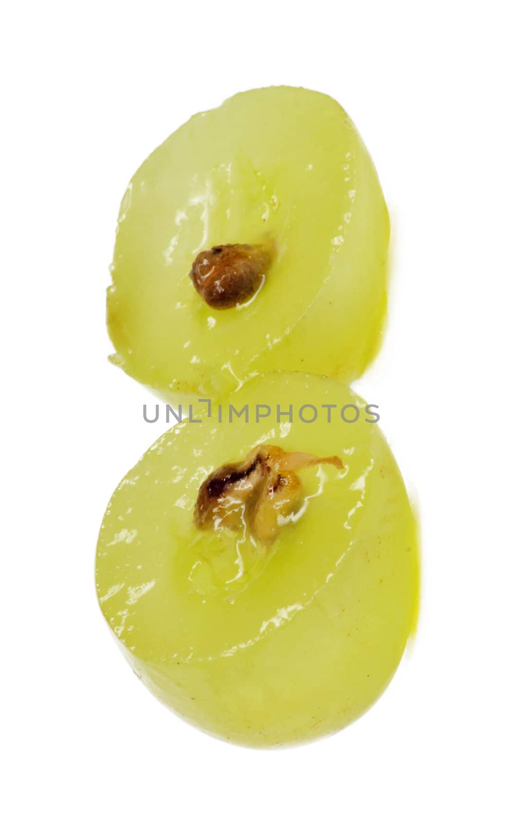 Translucent slice of green grape fruit, macro isolated on white 