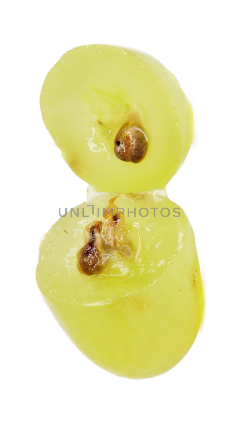 Translucent slice of green grape fruit, macro isolated on white 