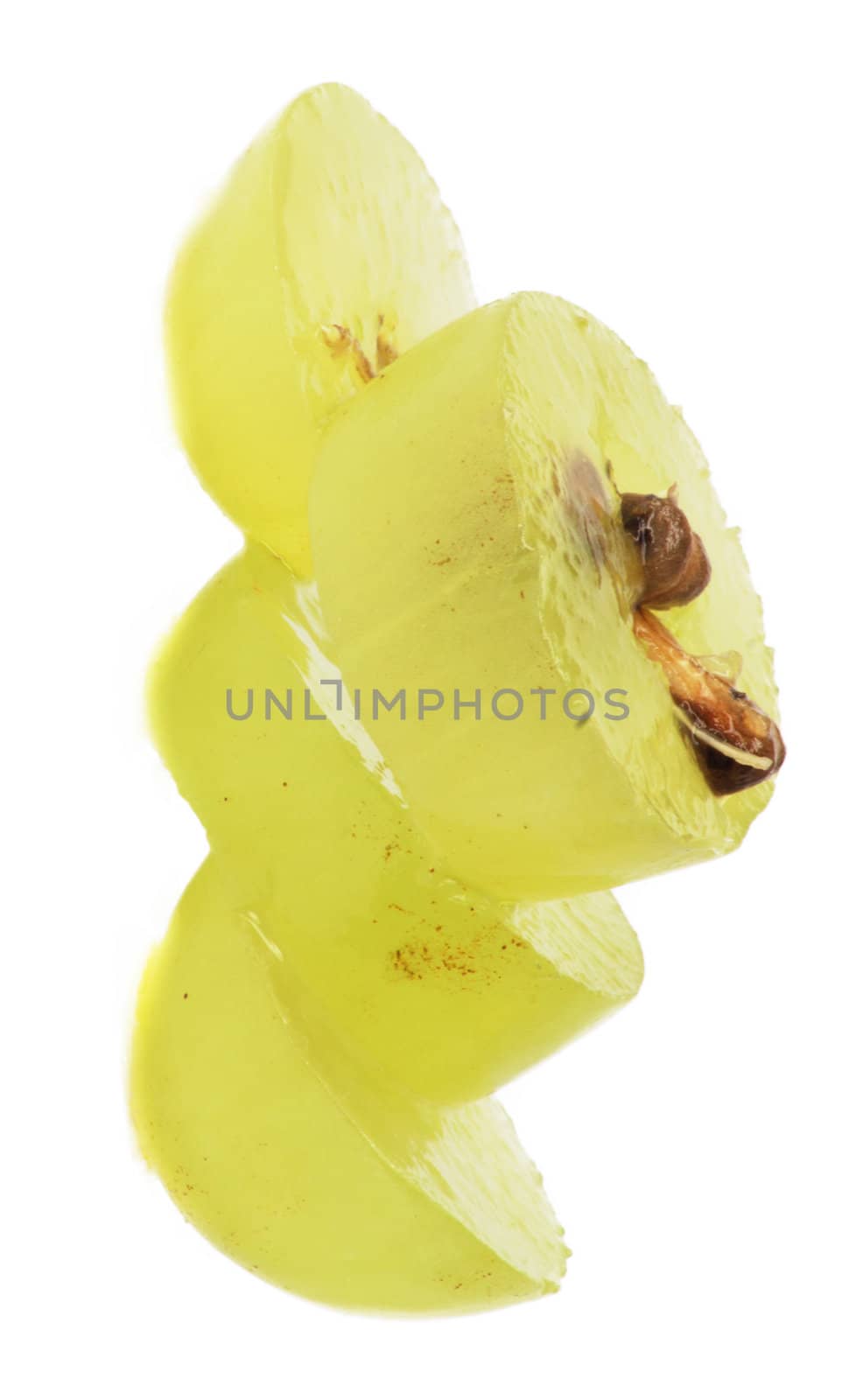 Translucent slice of green grape fruit, macro isolated on white 