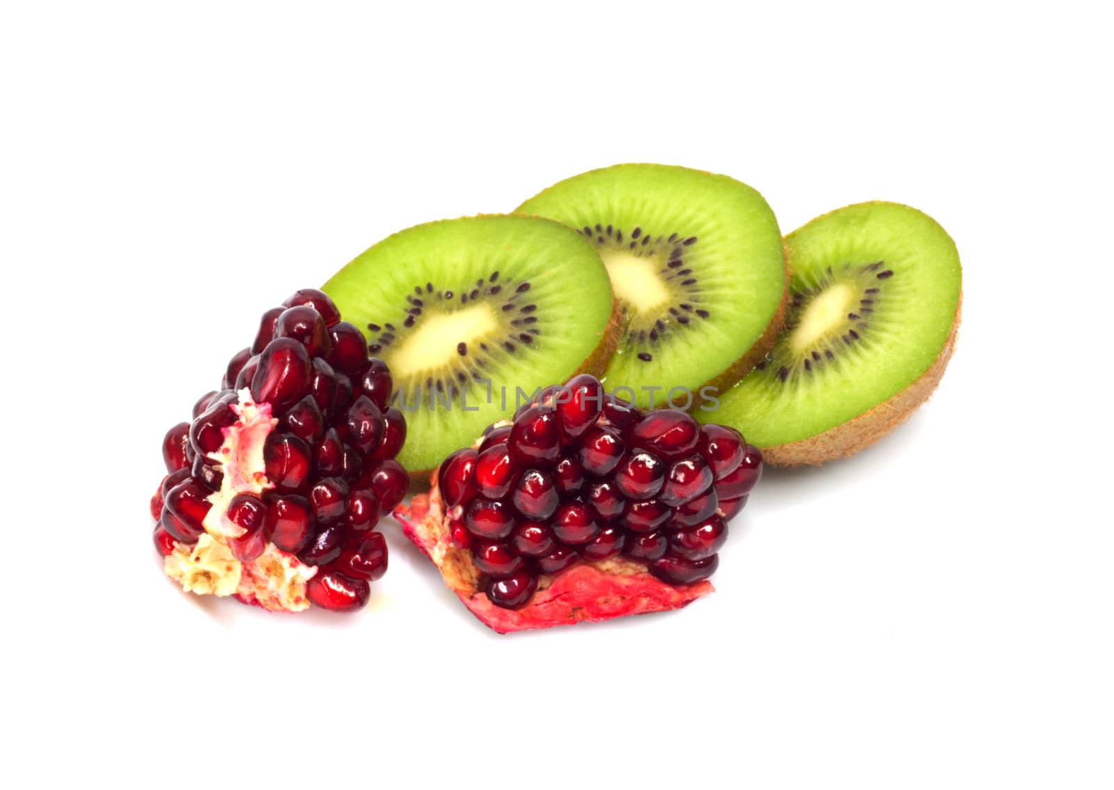 kiwi with pomegranate grain on white 