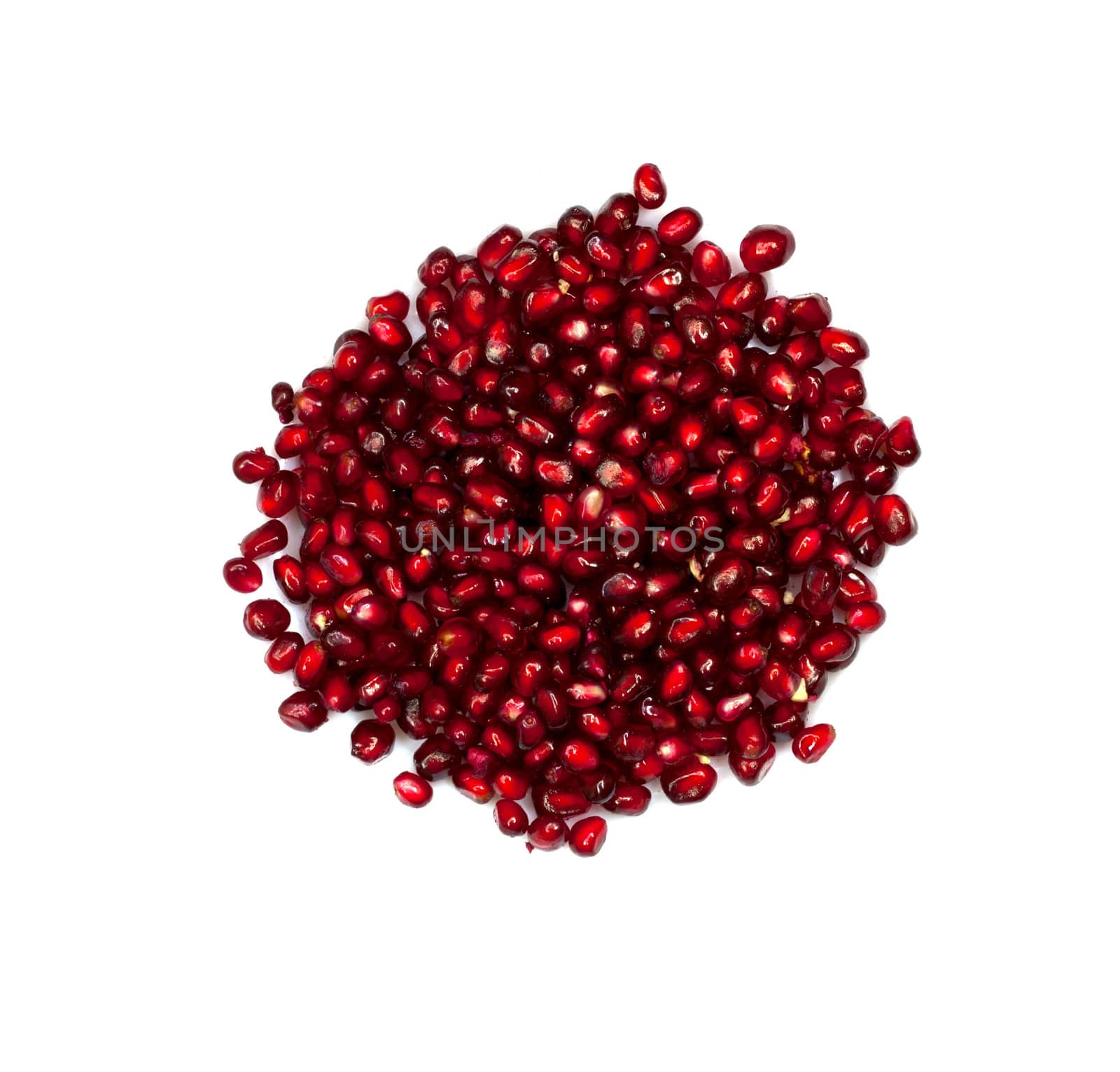 Extreme close up background of a red juicy ripe pomegranate fruit seeds 