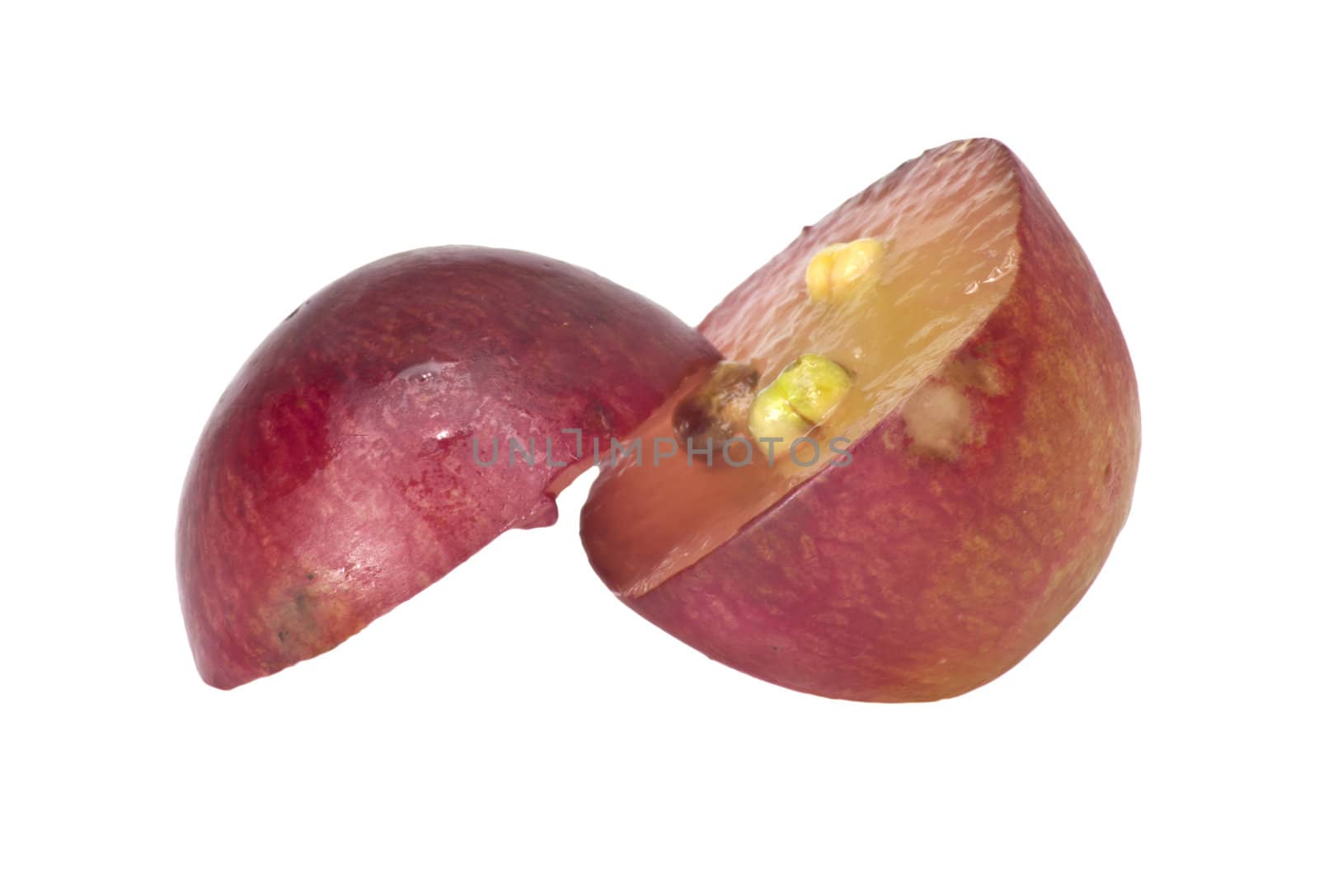Translucent slice of red grape fruit, macro isolated on white 