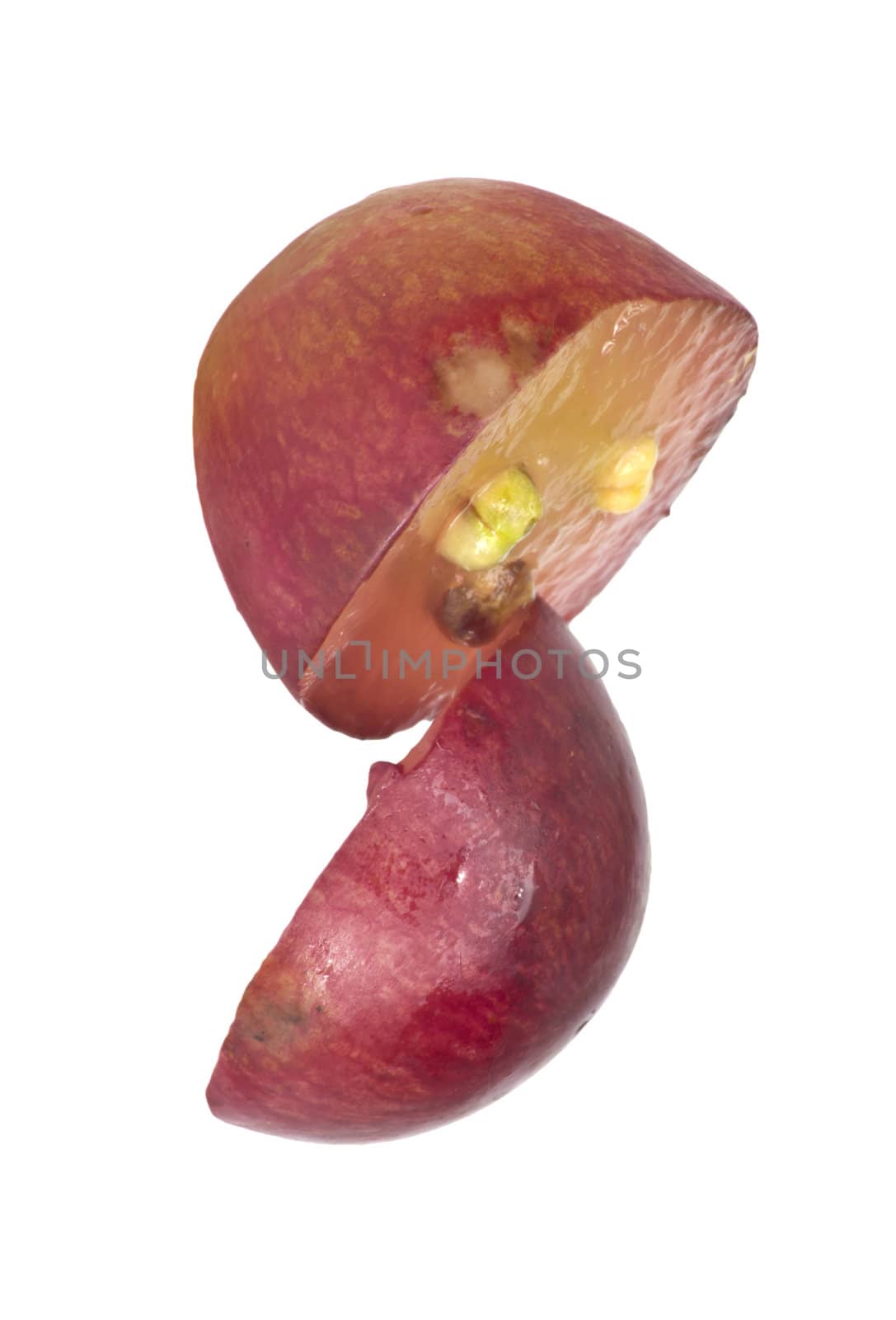 Translucent slice of red grape fruit, macro isolated on white 