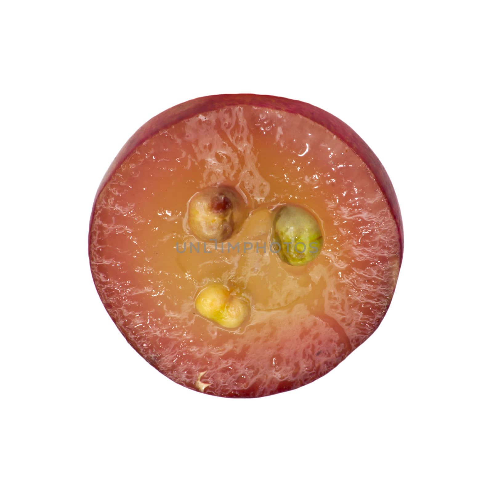 Translucent slice of red grape fruit, macro isolated on white 