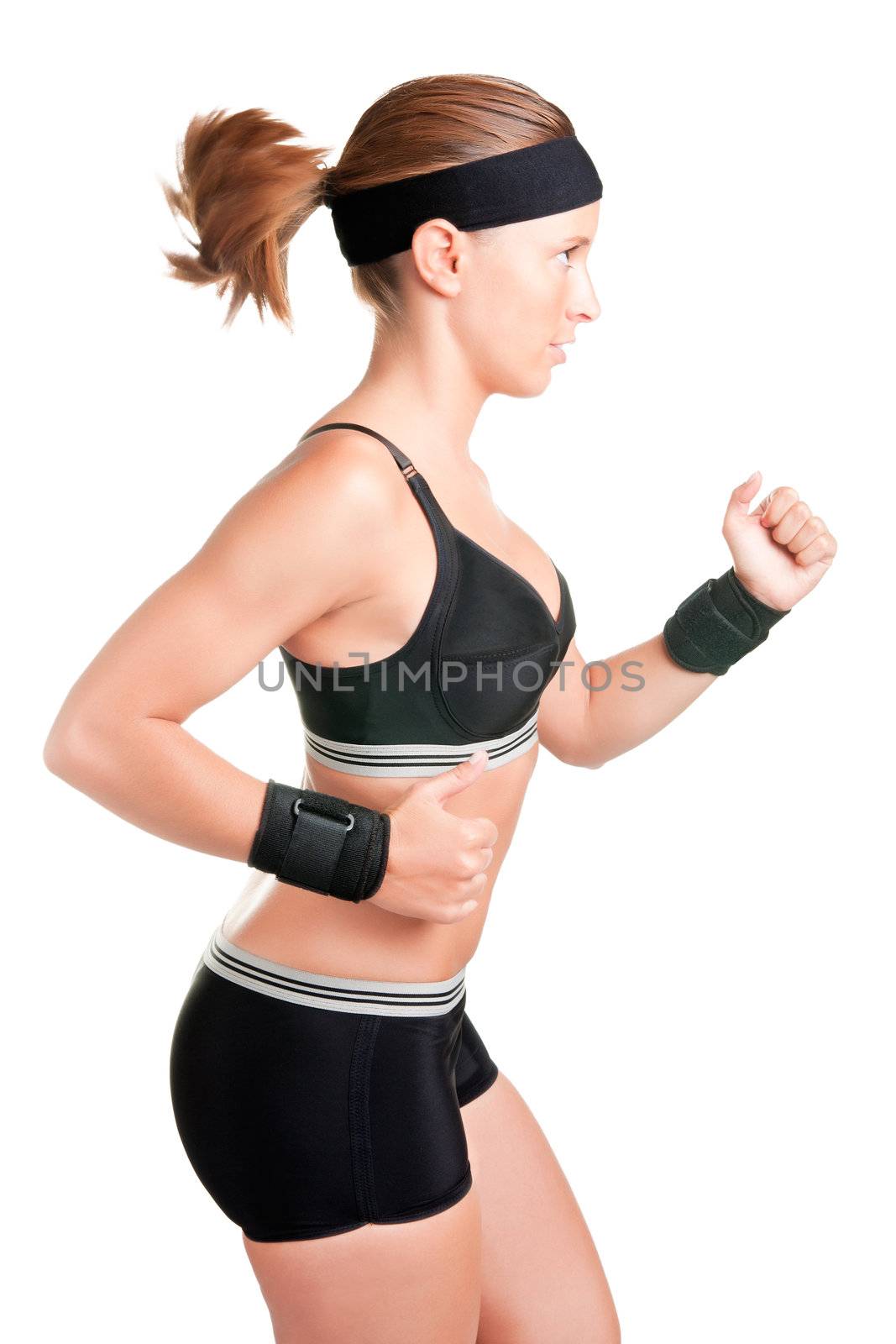 Young fit woman jogging, isolated in a white background