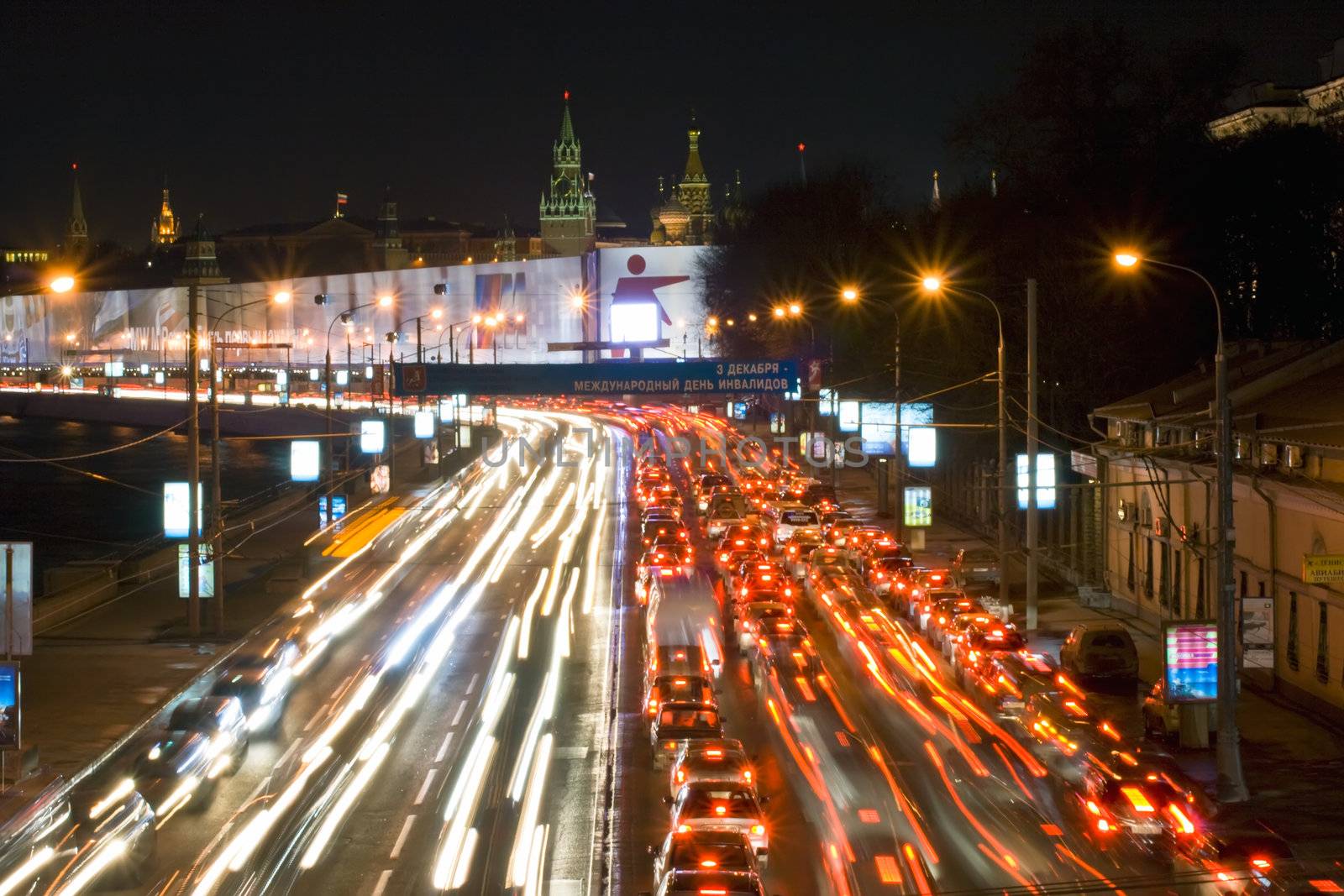 A road at nighttime illuminated by thousands of lights