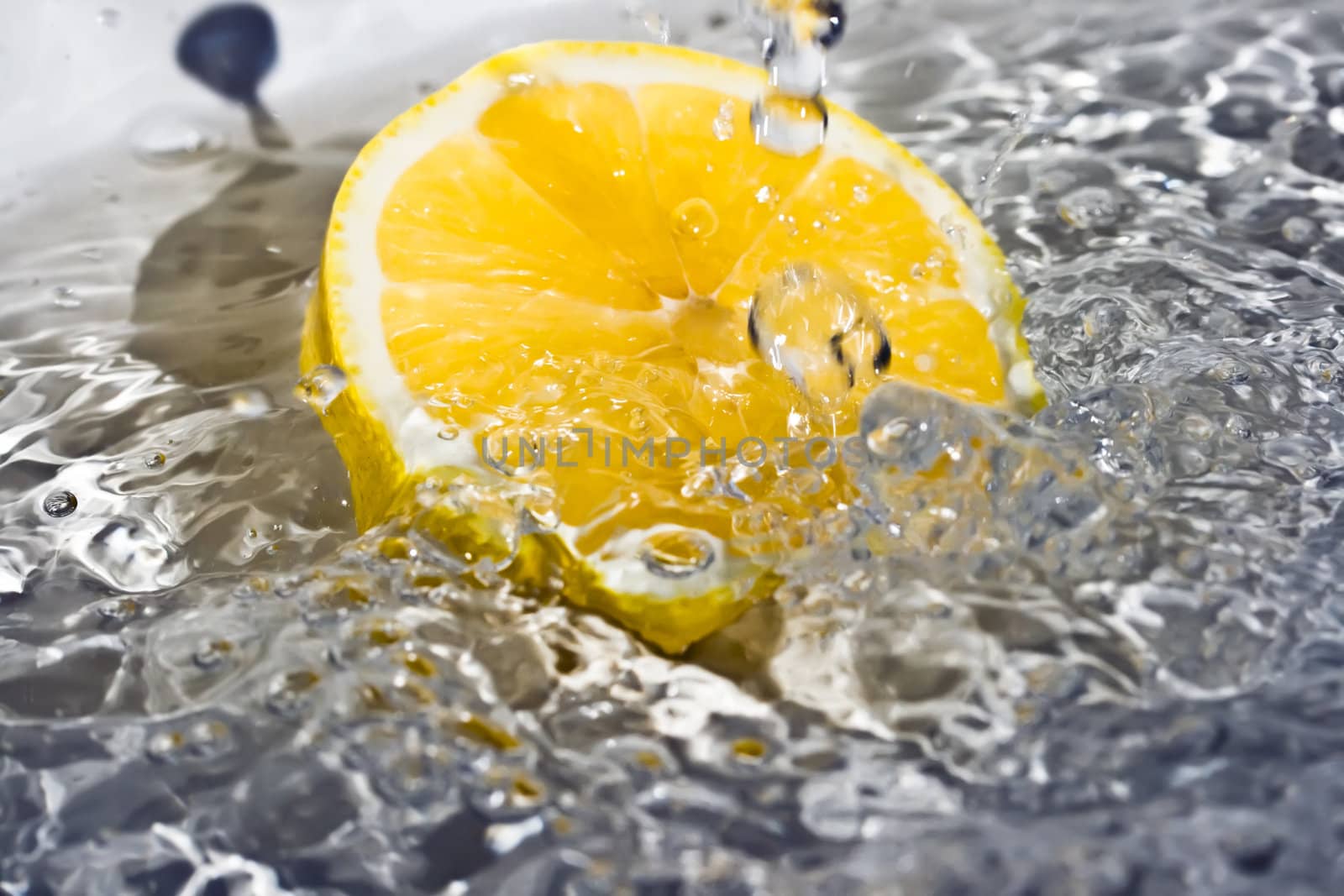 Fresh water drops on a lemon 