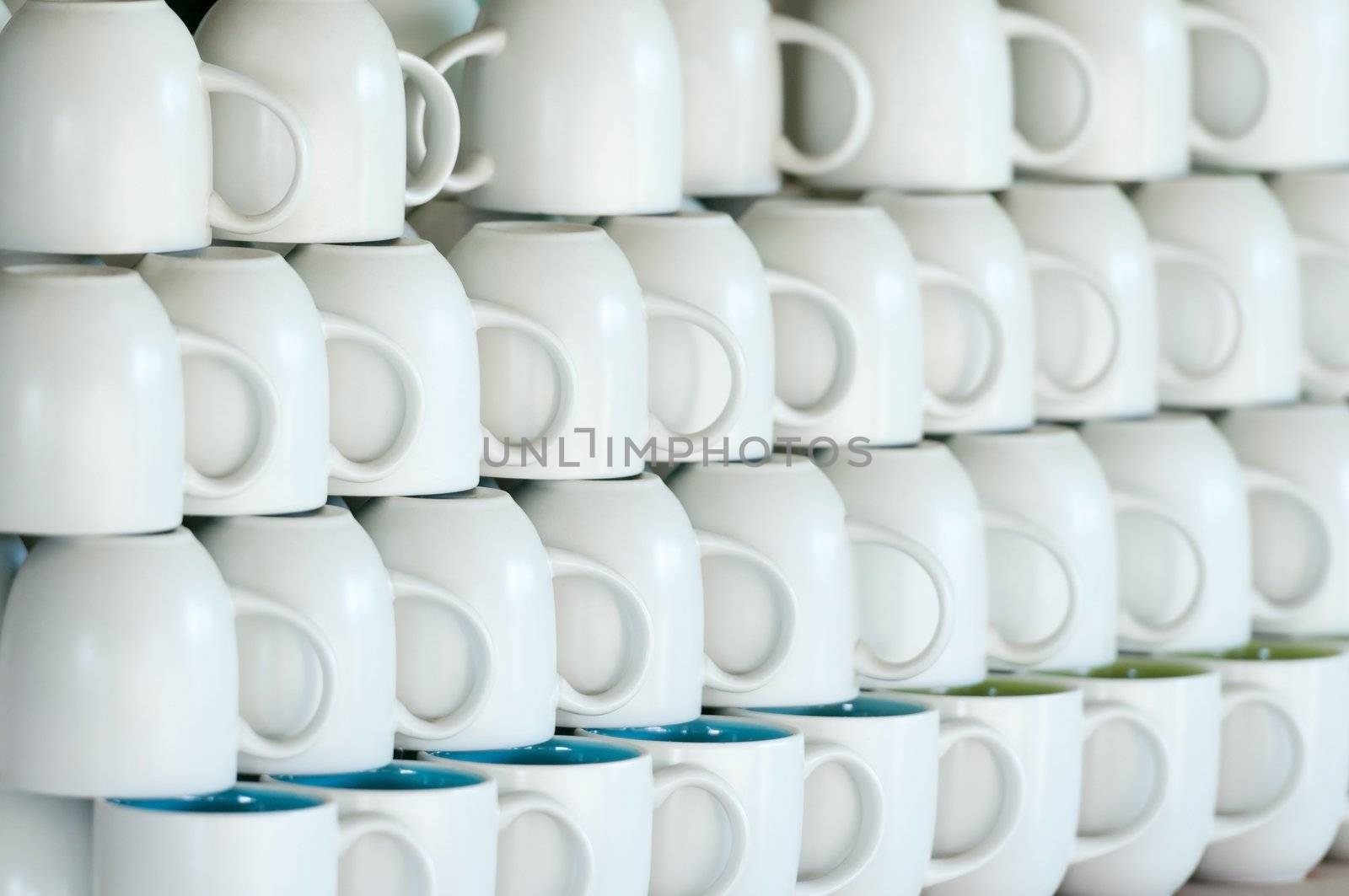 Shop counter with white cups lines. Shallow depth of field with selective focus on a left third