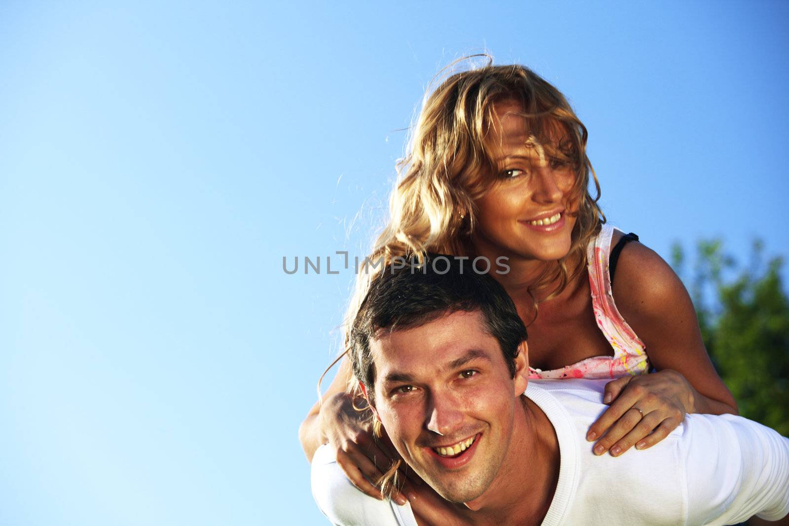 man and woman hug in the sky