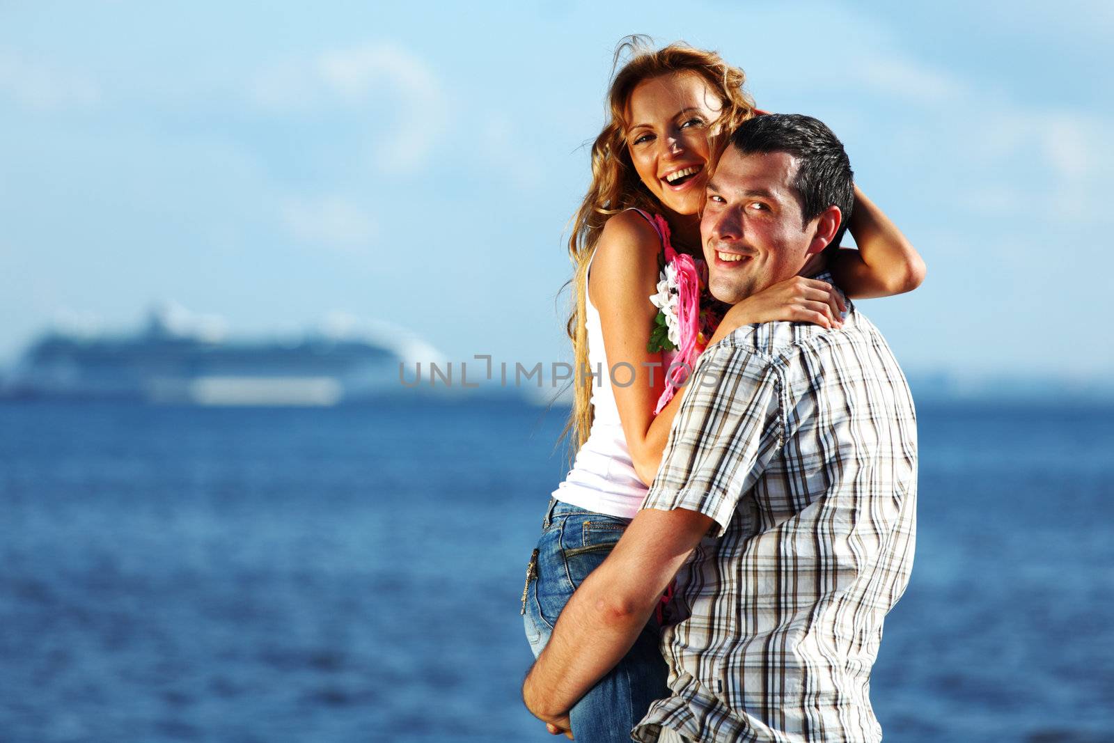 man and woman hug in the sky and sea on sea