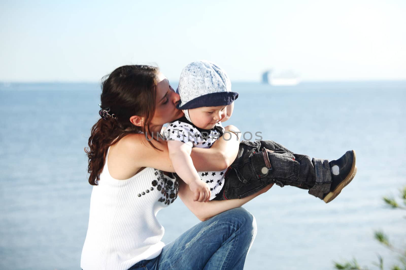 happy mother and son on picnic near sea