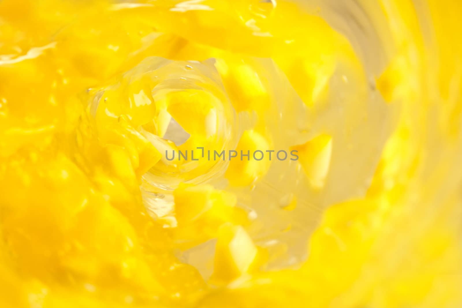 Lemon chunks drenched in a yellow whirlpool