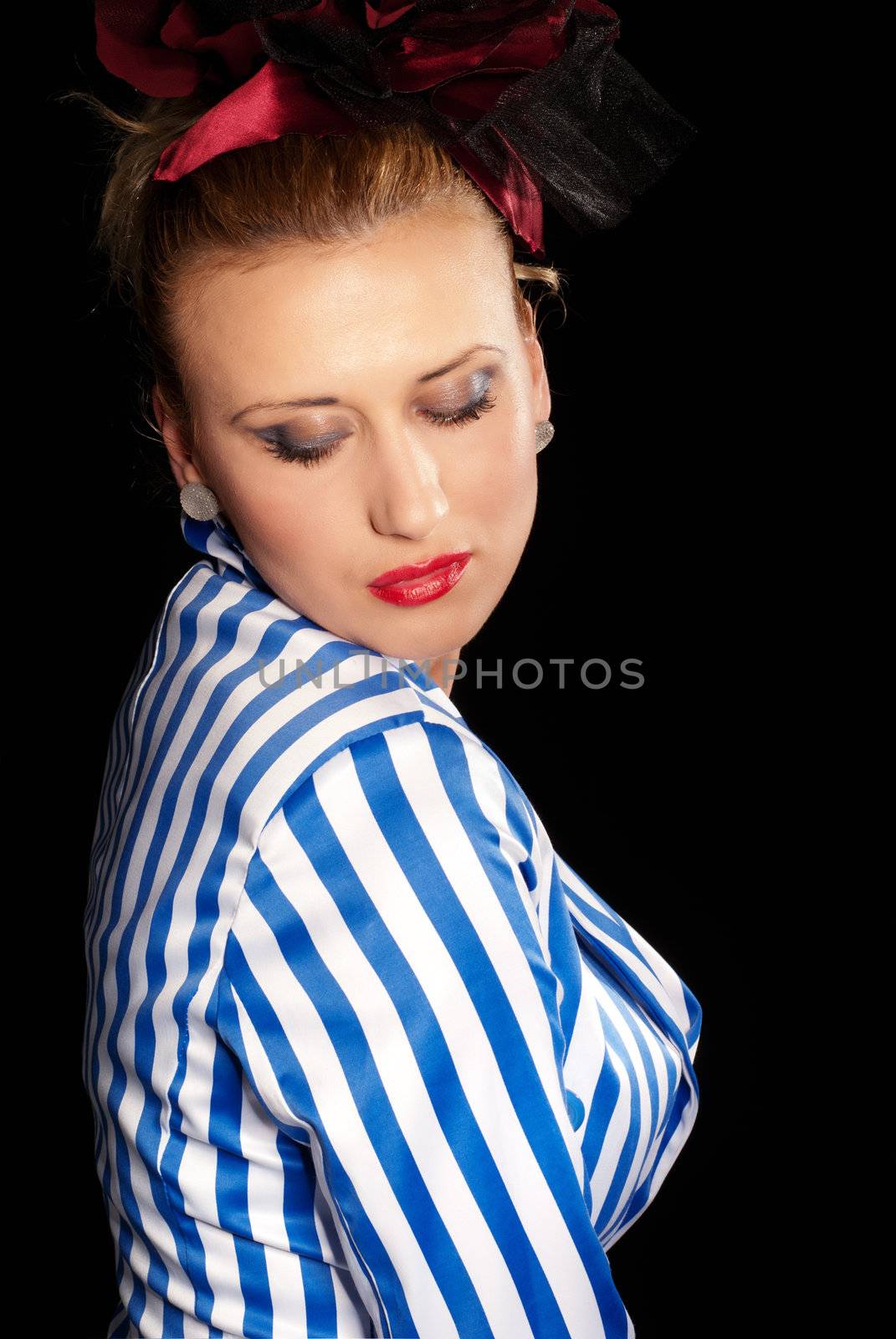 Side shot of a lady in a jacket isolated on black